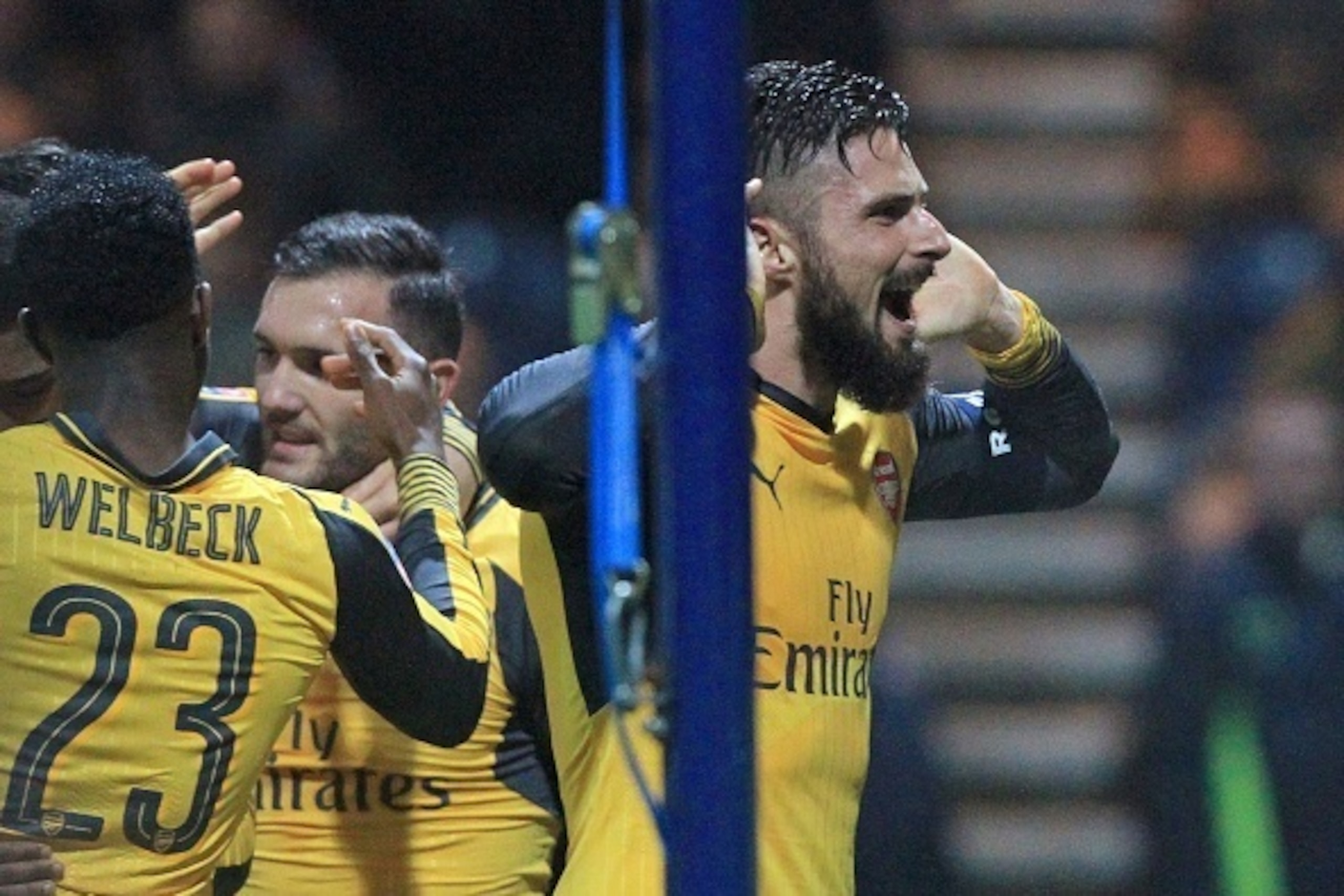 Arsenal's French striker Olivier Giroud (R) celebrates after scoring their second goal during the English FA Cup third round football match between Preston North End and Arsenal at Deepdale in north west England on January 7, 2017.
Arsenal won the game 2-