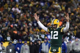 GREEN BAY, WI - JANUARY 08:  Aaron Rodgers #12 of the Green Bay Packers reacts to a score against the New York Giants during the NFC Wild Card game at Lambeau Field on January 8, 2017 in Green Bay, Wisconsin.  The Packers defeated the Giants 38-13.  (Phot