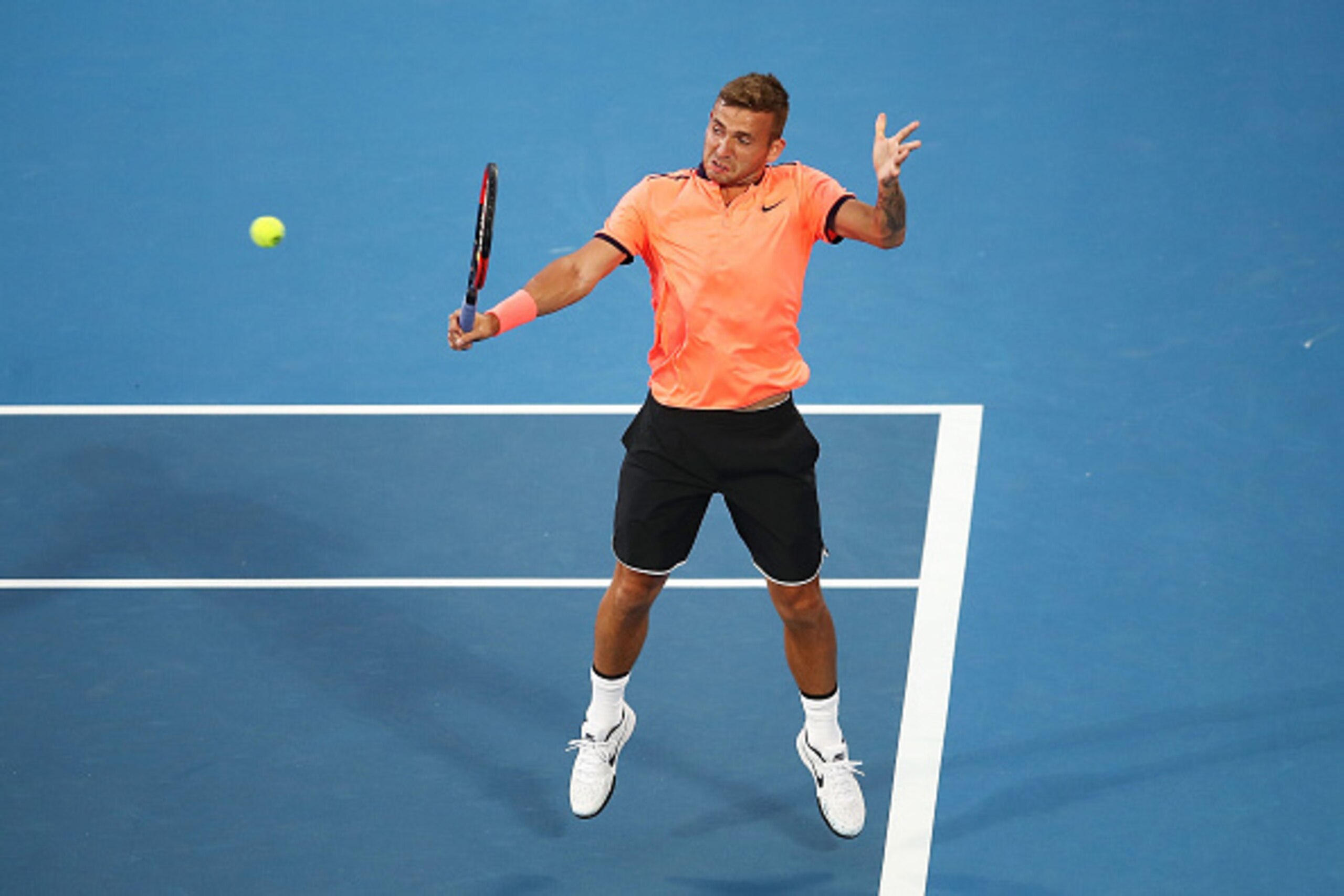 SYDNEY, AUSTRALIA - JANUARY 14:  Daniel Evans of Great Britain plays a backhand in the men's final match against Gilles Muller of Luxembourg during the 2017 Sydney International at Sydney Olympic Park Tennis Centre on January 14, 2017 in Sydney, Australia
