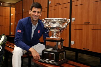 MELBOURNE, AUSTRALIA - FEBRUARY 01:  Novak Djokovic of Serbia poses with the Norman Brookes Challenge Cup in the players change rooms after winning the Men's Singles Final against Andy Murray of Great Britain during day 14 of the 2016 Australian Open at M