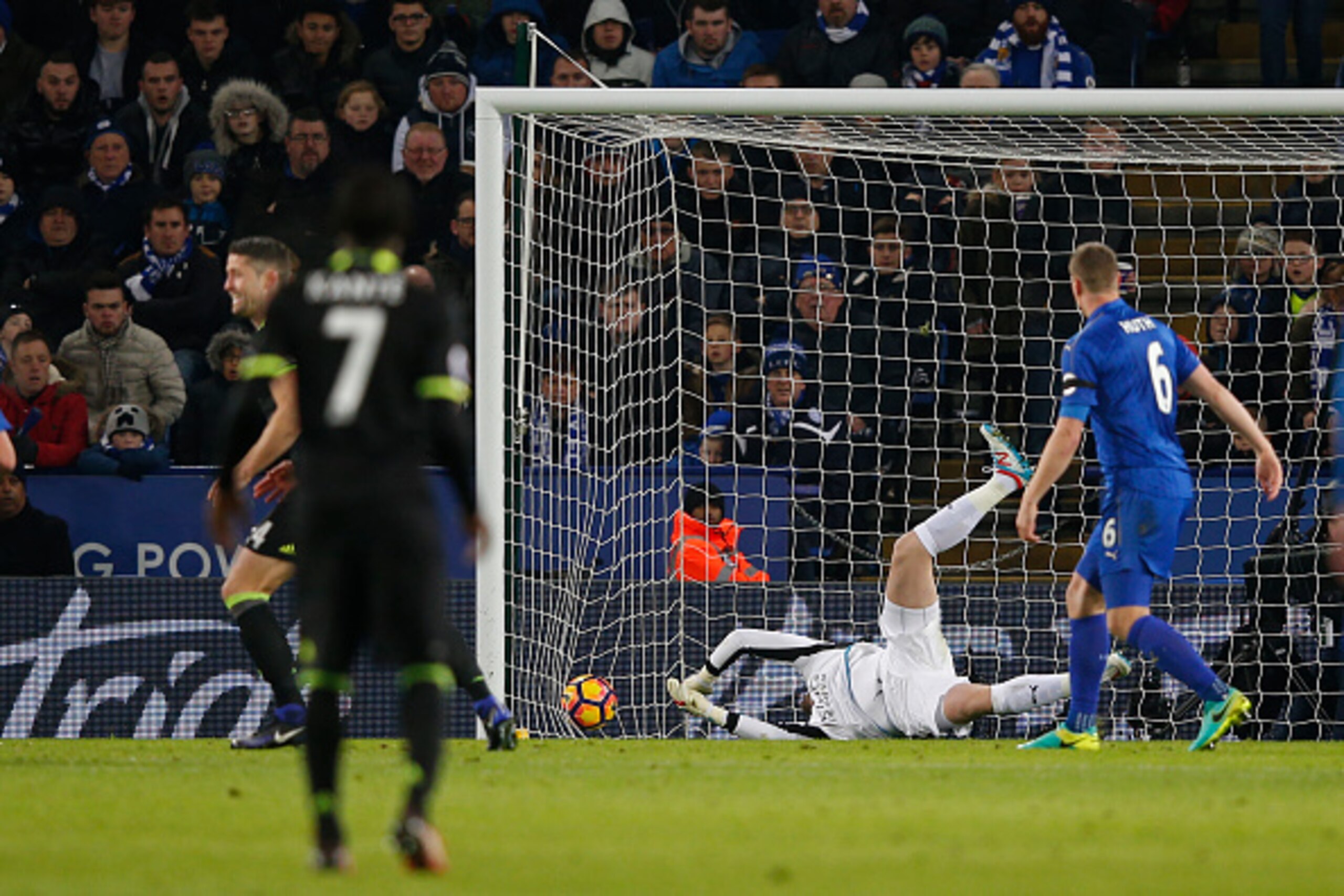 Leicester City's Danish goalkeeper Kasper Schmeichel (C) is unable to save Chelsea's Spanish defender Marcos Alonso's deflected shot as Chelsea take a 2-0 lead in the English Premier League football match between Leicester City and Chelsea at King Power S