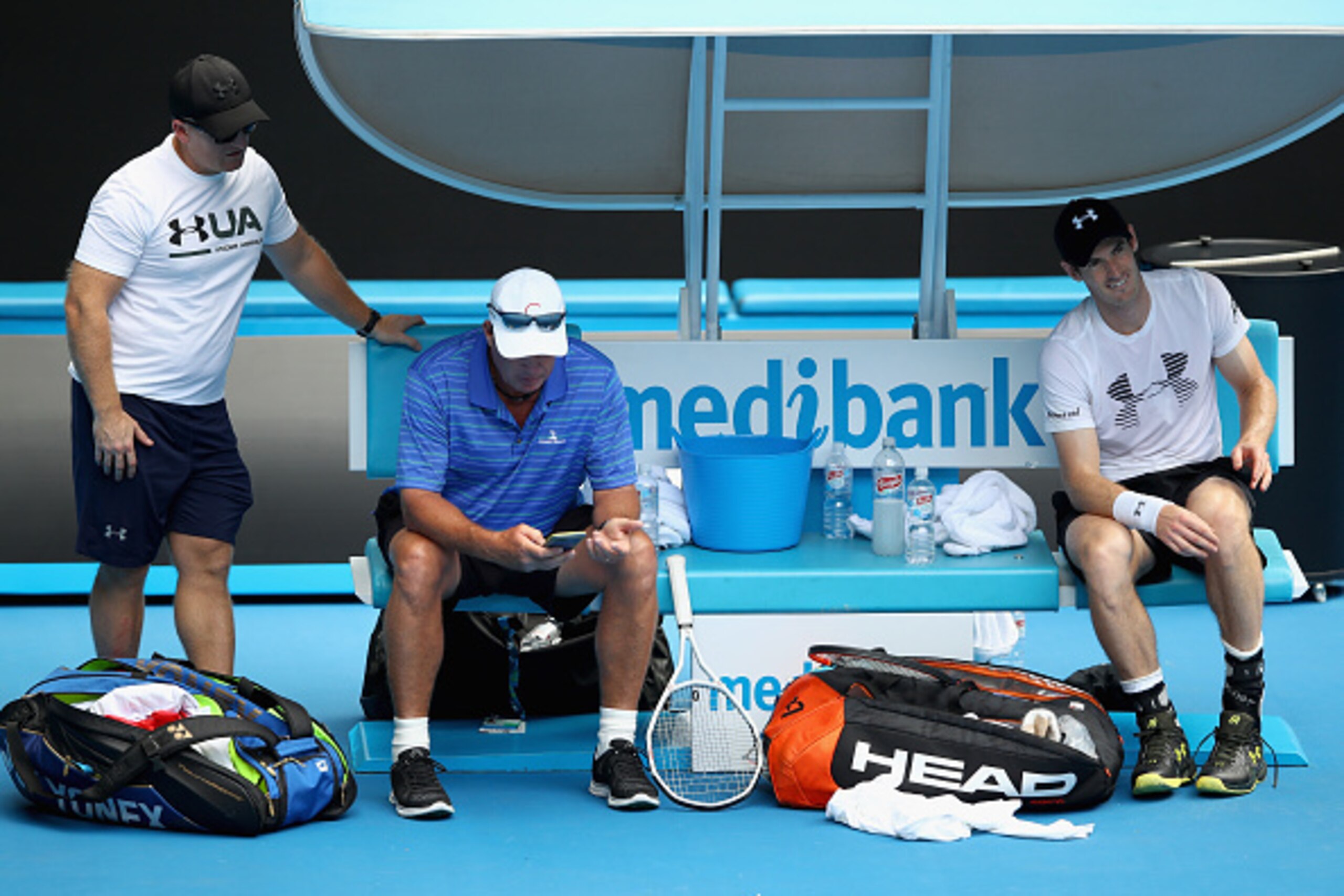 MELBOURNE, AUSTRALIA - JANUARY 14:  Andy Murray of Great Britain kicks off his shoe to have treatment on his left foot during a practice session ahead of the 2017 Australian Open at Melbourne Park on January 14, 2017 in Melbourne, Australia.  (Photo by Cl