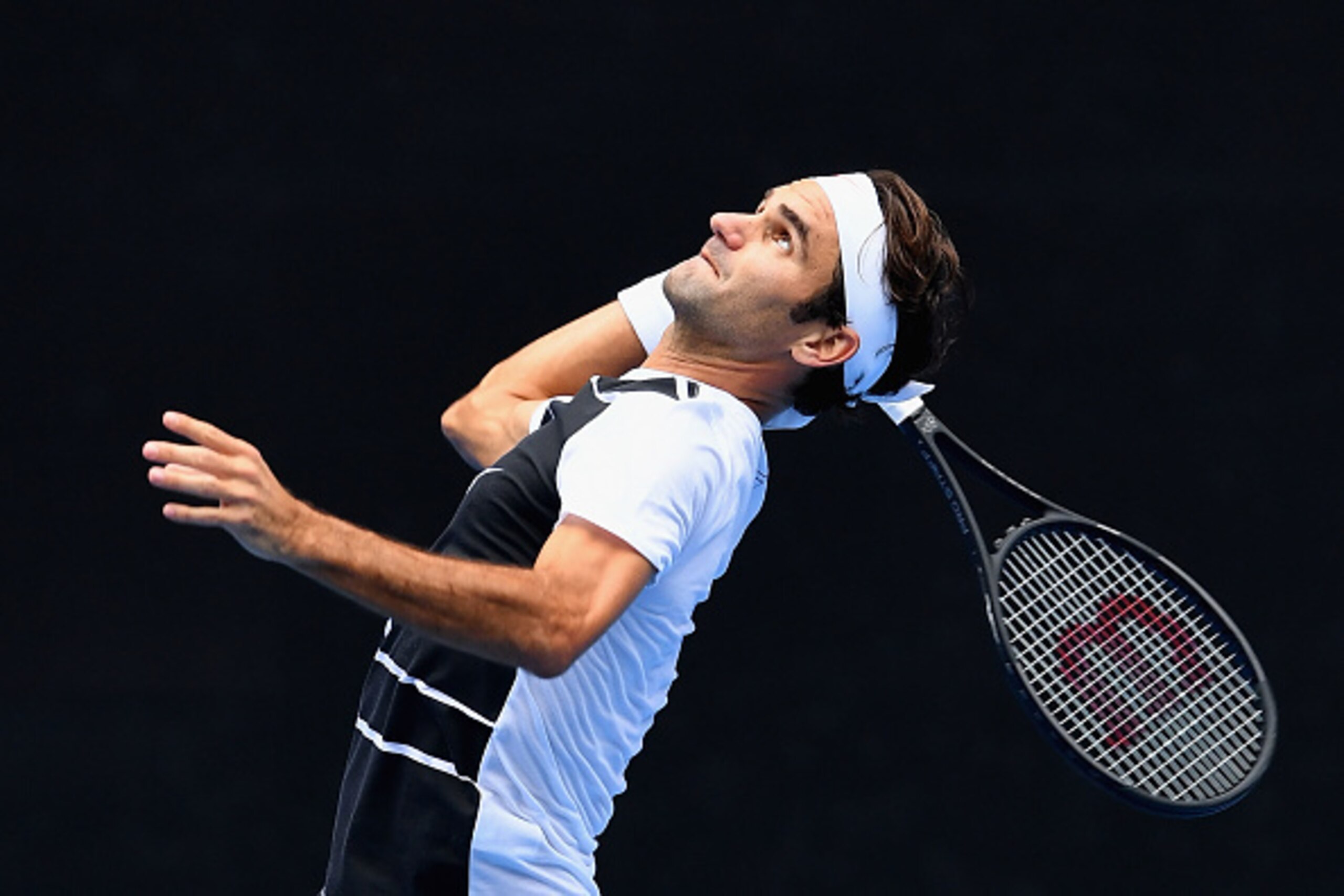 MELBOURNE, AUSTRALIA - JANUARY 14:  Roger Federer of Switzerland serves during a practice session ahead of the 2017 Australian Open at Melbourne Park on January 14, 2017 in Melbourne, Australia.  (Photo by Quinn Rooney/Getty Images)