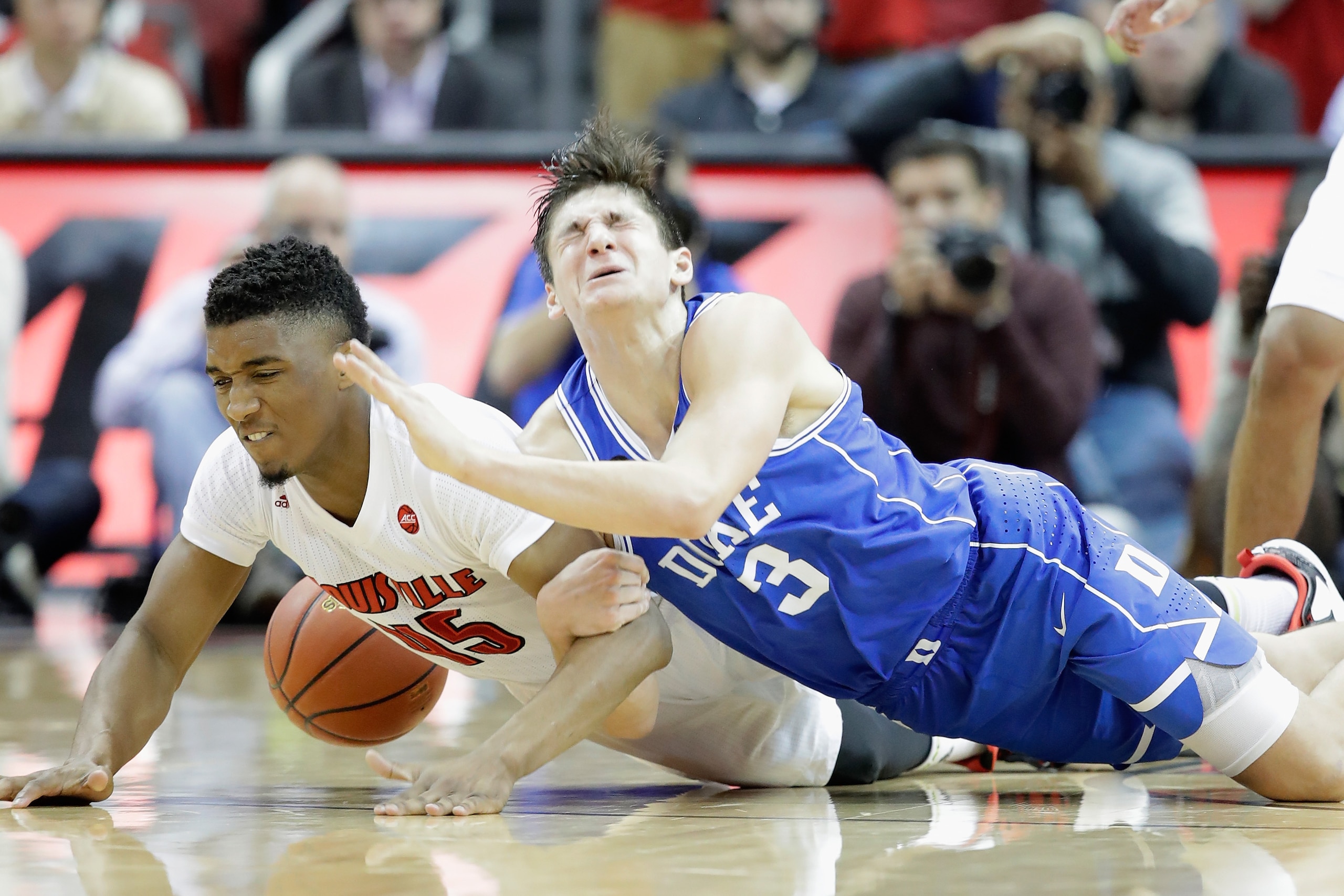 LOUISVILLE, KY - JANUARY 14:  Donvan Mitchell #45 of the Louisville Cardinals and Grayson Allen #3 of the Duke Blue Devils battle for a loose ball during the game at KFC YUM! Center on January 14, 2017 in Louisville, Kentucky.  (Photo by Andy Lyons/Getty