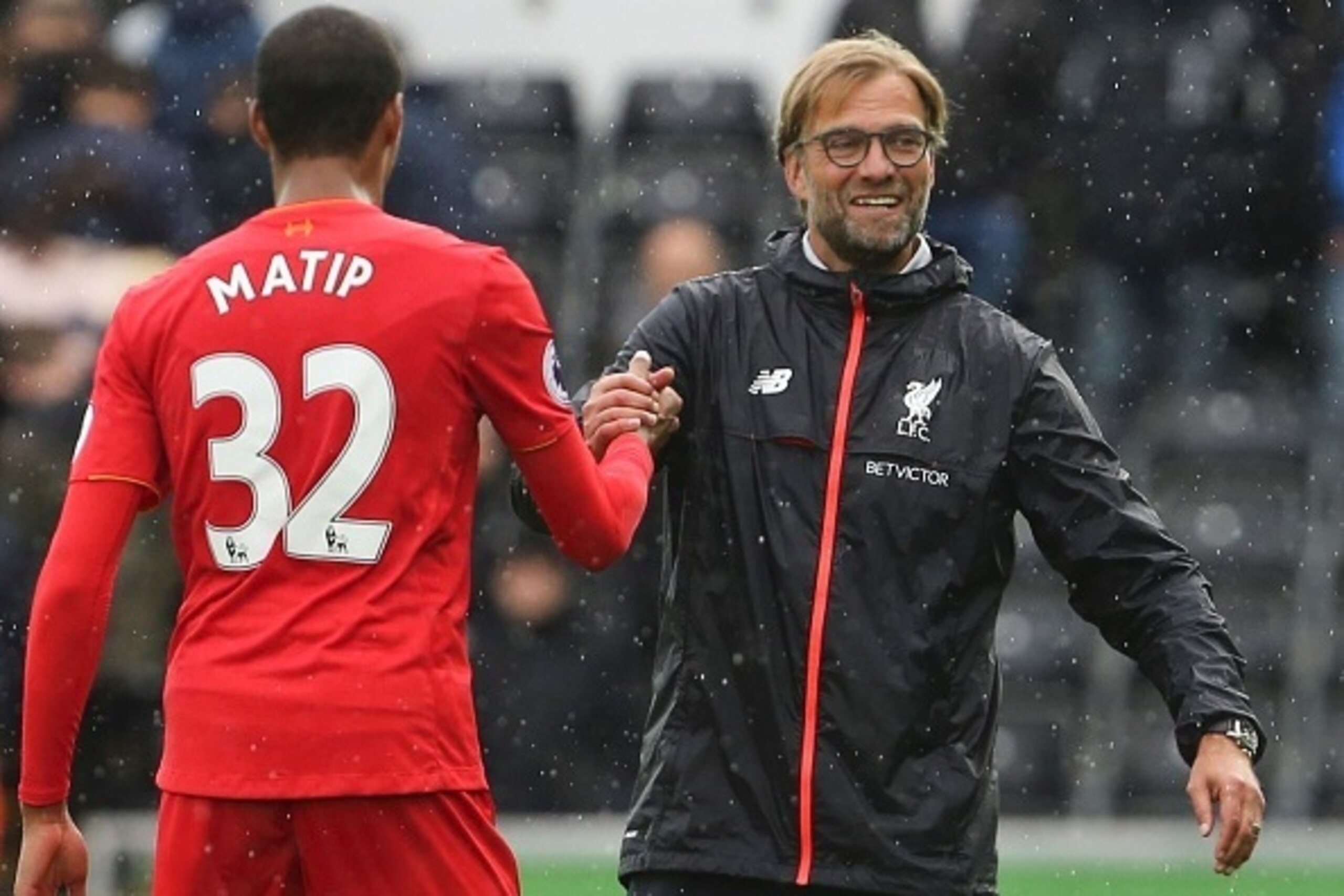 Liverpool's German manager Jurgen Klopp (R) shakes hands with Liverpool's German-born Cameroonian defender Joel Matip (L) at the end of the English Premier League football match between Swansea City and Liverpool at The Liberty Stadium in Swansea, south W