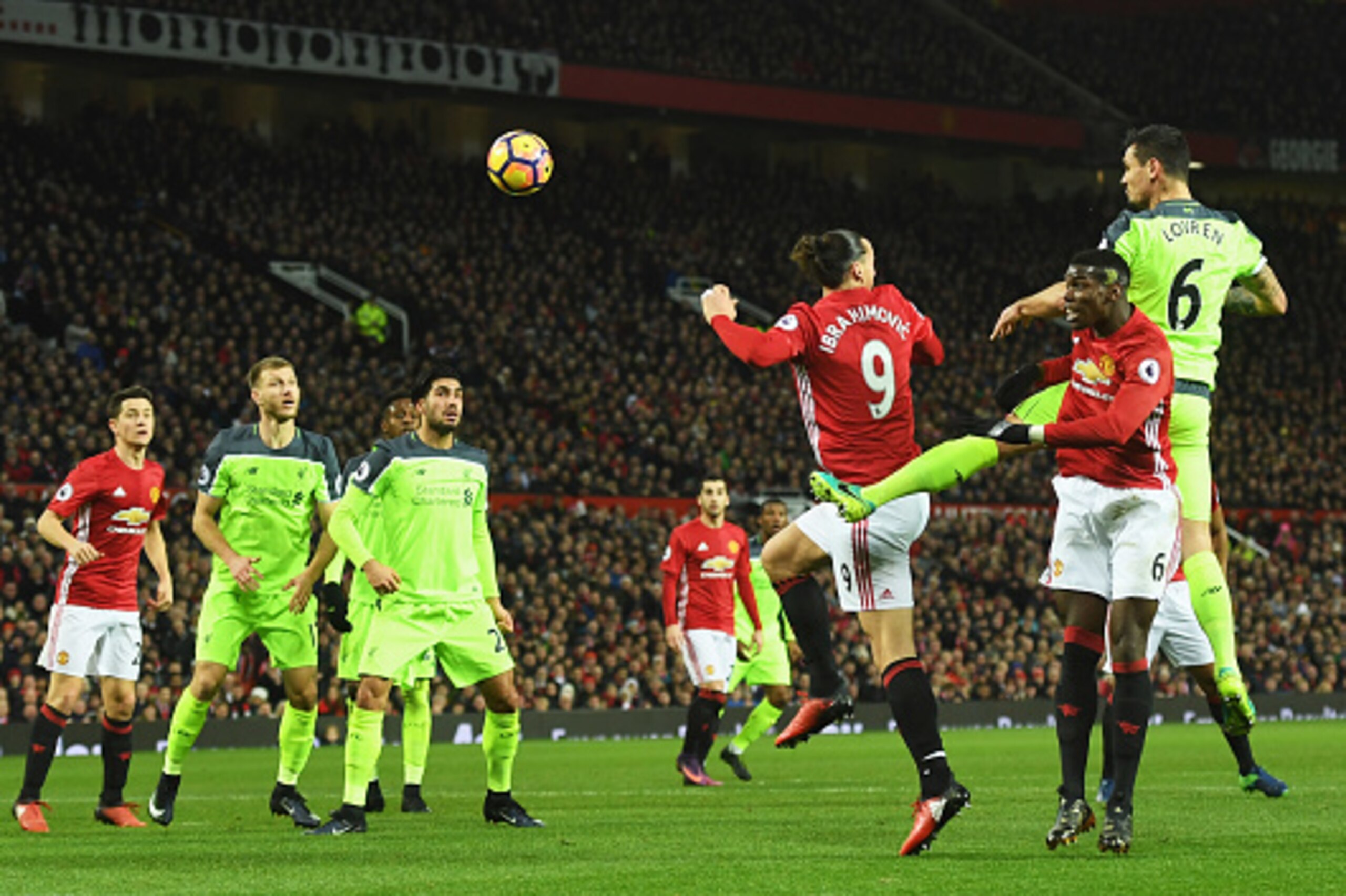 MANCHESTER, ENGLAND - JANUARY 15: Dejan Lovren of Liverpool (R) outjumps Paul Pogba (6) and Zlatan Ibrahimovic of Manchester United (9) during the Premier League match between Manchester United and Liverpool at Old Trafford on January 15, 2017 in Manches MANCHESTER, ENGLAND - JANUARY 15: Dejan Lovren of Liverpool (R) outjumps Paul Pogba (6) and Zlatan Ibrahimovic of Manchester United (9) during the Premier League match between Manchester United and Liverpool at Old Trafford on January 15, 2017 in Manches