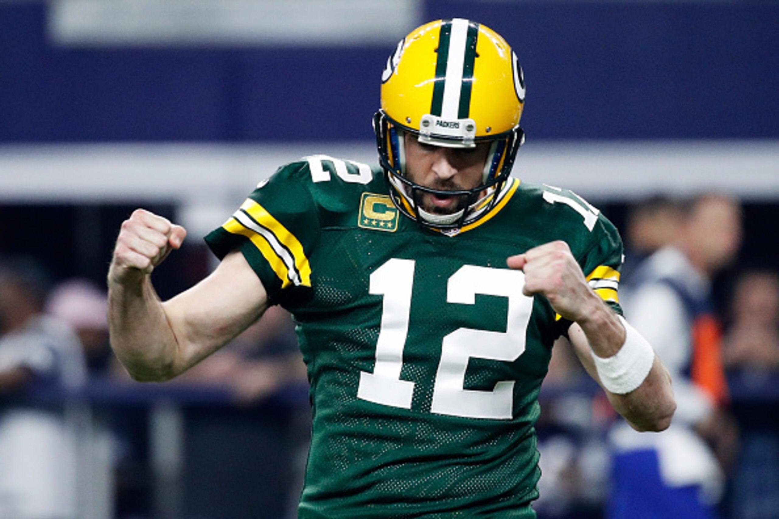 ARLINGTON, TX - JANUARY 15: Aaron Rodgers #12 of the Green Bay Packers reacts after scoring a touchdown in the first half during the NFC Divisional Playoff Game against the Dallas Cowboys at AT&T Stadium on January 15, 2017 in Arlington, Texas. (Photo by ARLINGTON, TX - JANUARY 15: Aaron Rodgers #12 of the Green Bay Packers reacts after scoring a touchdown in the first half during the NFC Divisional Playoff Game against the Dallas Cowboys at AT&T Stadium on January 15, 2017 in Arlington, Texas. (Photo by