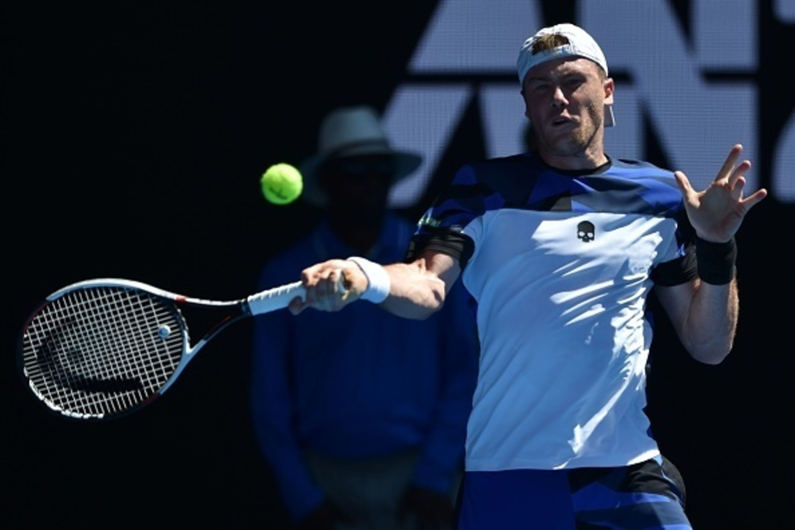 Britain's Andy Murray hits a return against Ukraine's Illya Marchenko during their men's singles match on day one of the Australian Open tennis tournament in Melbourne on January 16, 2017. / AFP / PETER PARKS / IMAGE RESTRICTED TO EDITORIAL USE - STRICTLY