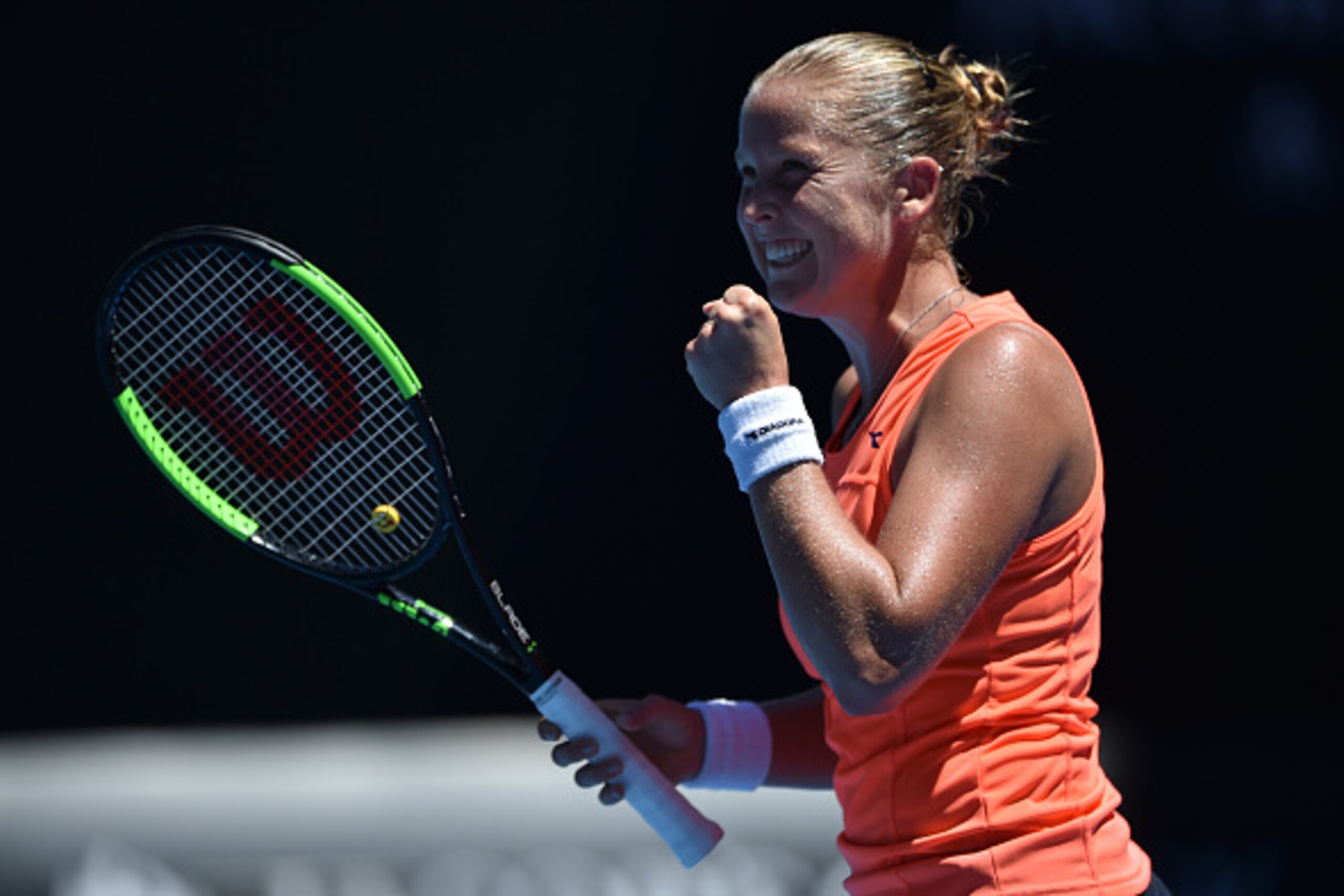 Shelby Rogers of the US celebrates her victory against Romania's Simona Halep during their women's singles match on day one of the Australian Open tennis tournament in Melbourne on January 16, 2017. / AFP / PETER PARKS / IMAGE RESTRICTED TO EDITORIAL USE 