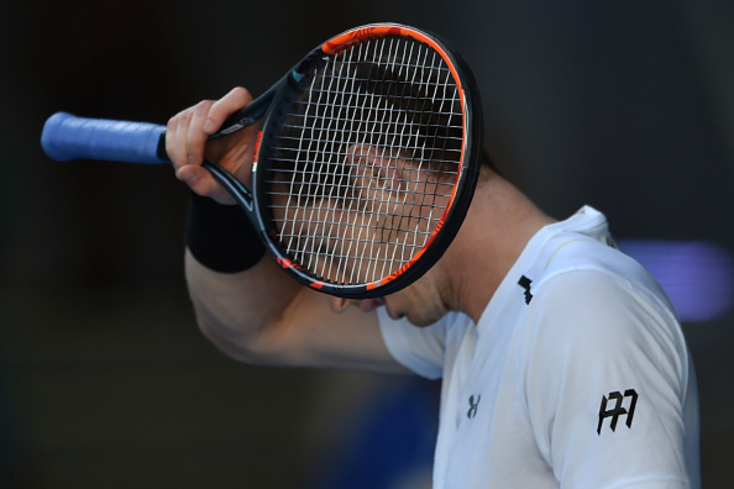 Britain's Andy Murray reacts after a point against Ukraine's Illya Marchenko during their men's singles match on day one of the Australian Open tennis tournament in Melbourne on January 16, 2017. / AFP / PETER PARKS / IMAGE RESTRICTED TO EDITORIAL USE - S