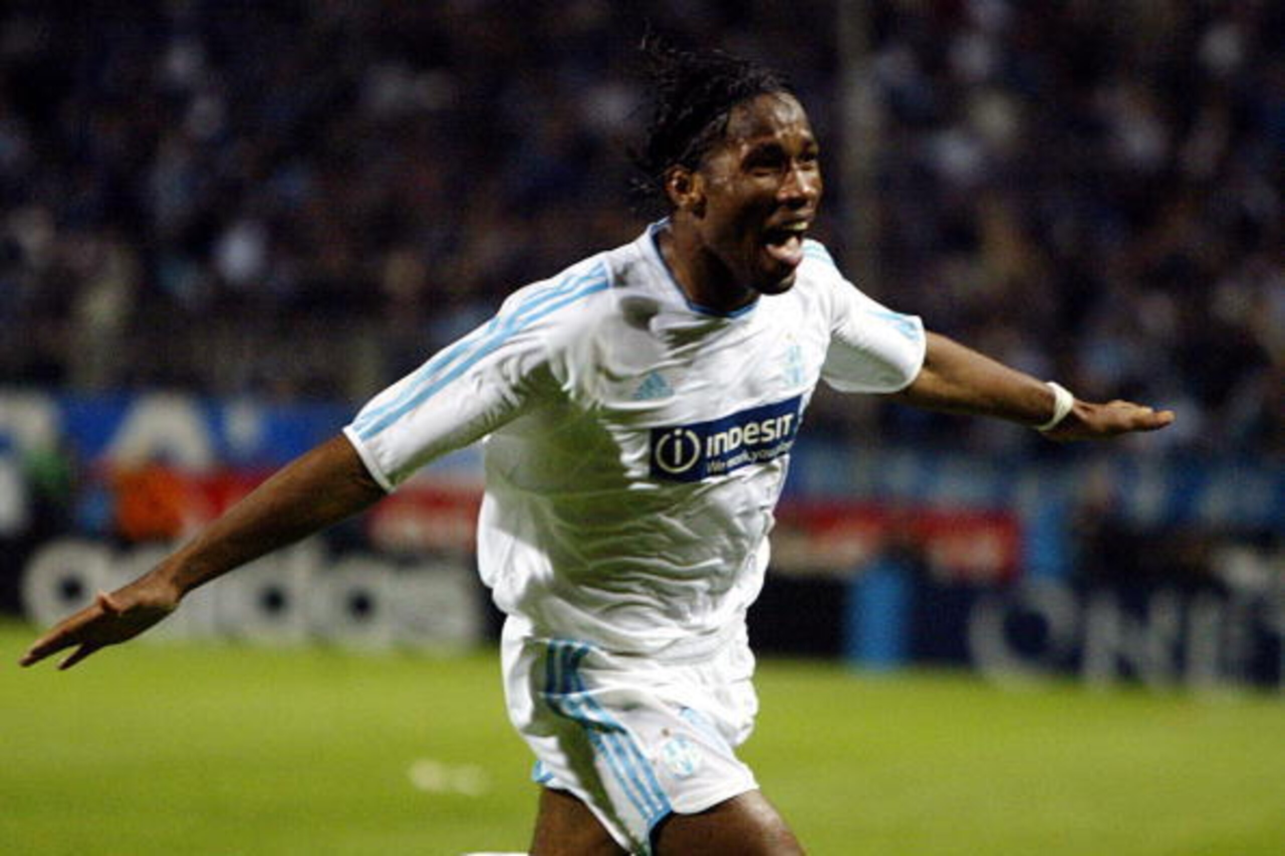 MARSEILLE, France:  Marseille's Ivorian forward Didier Drogba jubilates after scoring the second goal during the UEFA Cup semi-final second leg football match against Newcastle, 06 May 2004 at the Velodrome stadium in Marseille.  AFP PHOTO GERARD JULIEN  