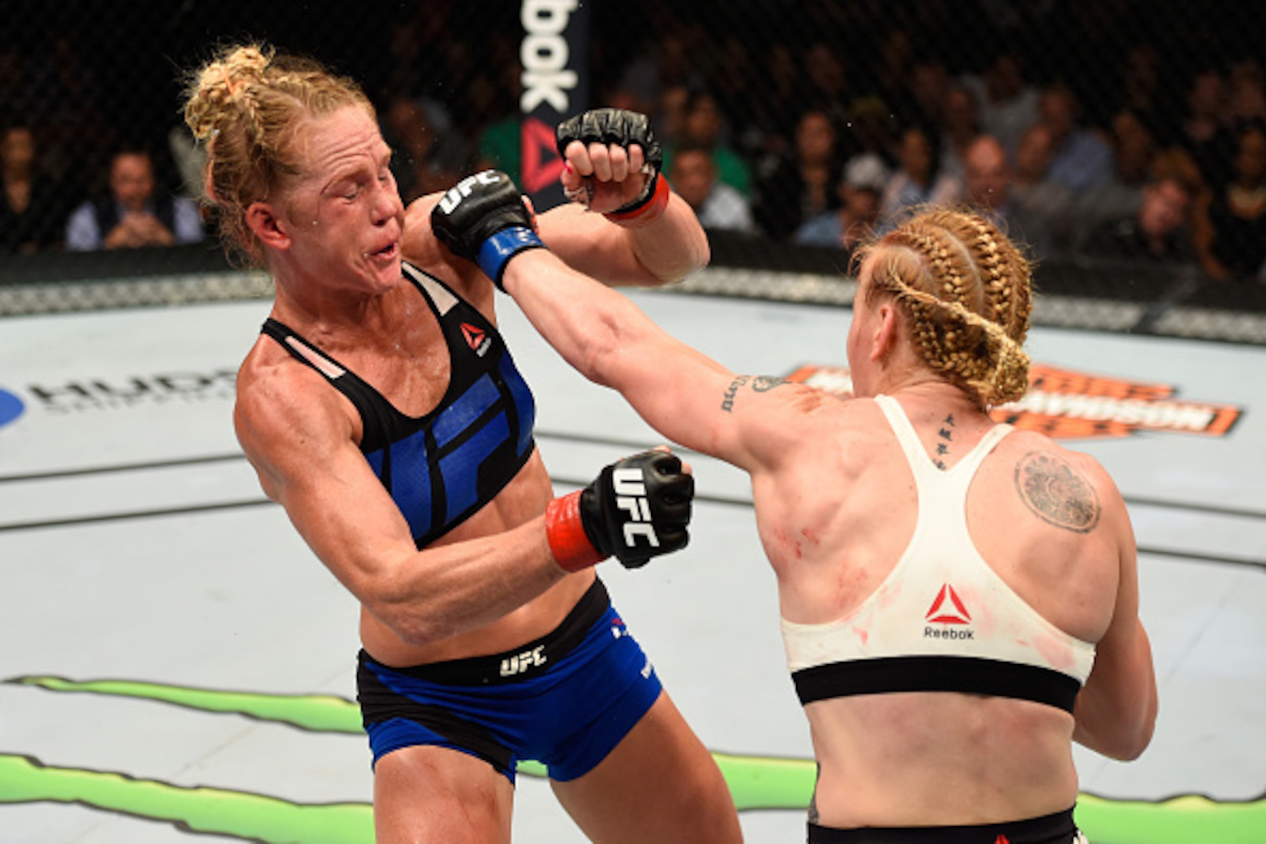 CHICAGO, IL - JULY 23:  (R-L) Valentina Shevchenko of Kyrgyzstan punches Holly Holm in their women's bantamweight bout during the UFC Fight Night event at the United Center on July 23, 2016 in Chicago, Illinois. (Photo by Josh Hedges/Zuffa LLC/Zuffa LLC v