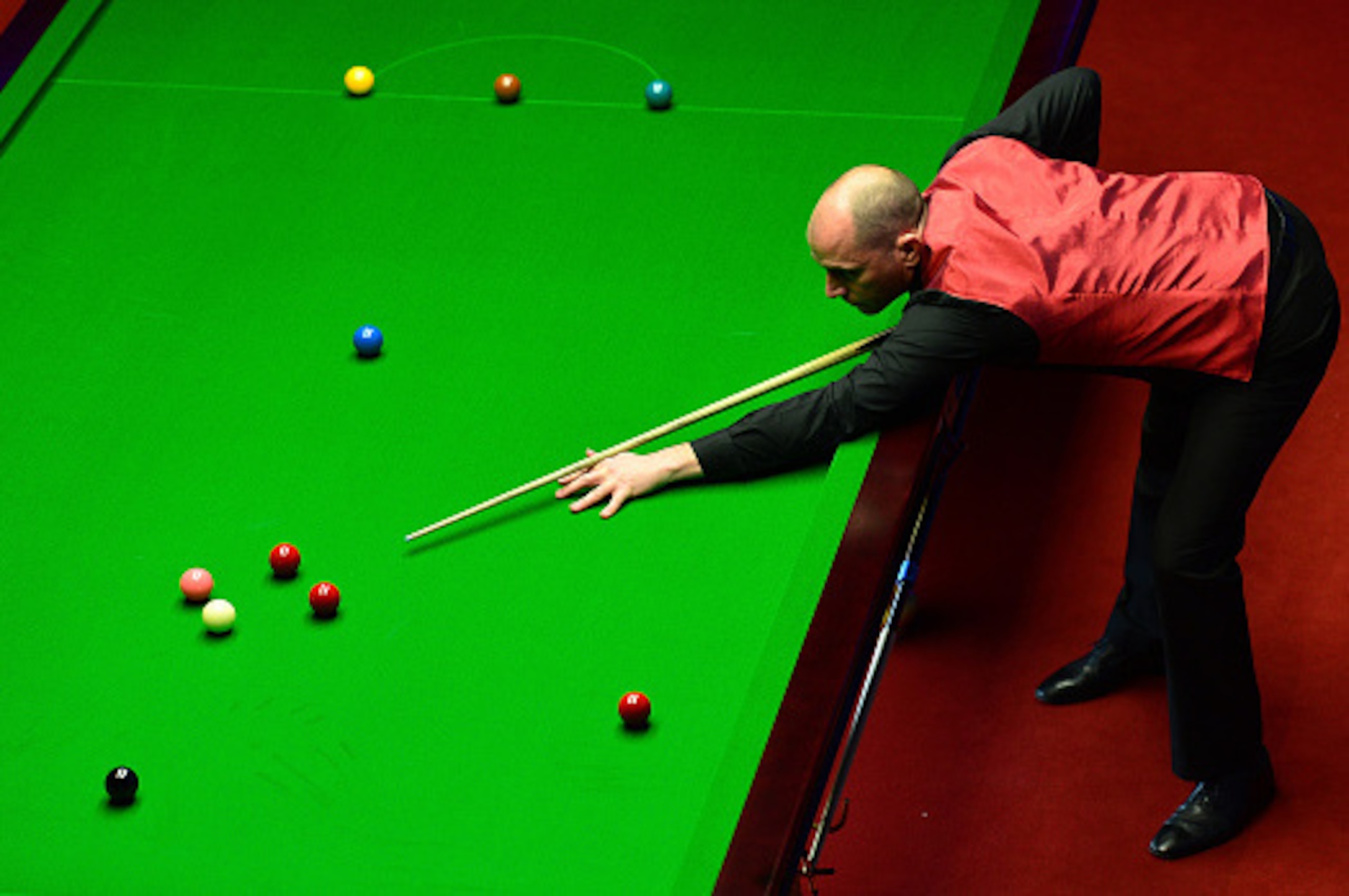 SHEFFIELD, ENGLAND - APRIL 21:  Joe Perry of England plays a shot during his first round match against Kyren Wilson of England on day six of the World Snooker Championship at The Crucible Theatre on April 21, 2016 in Sheffield, England.  (Photo by Dan Mul