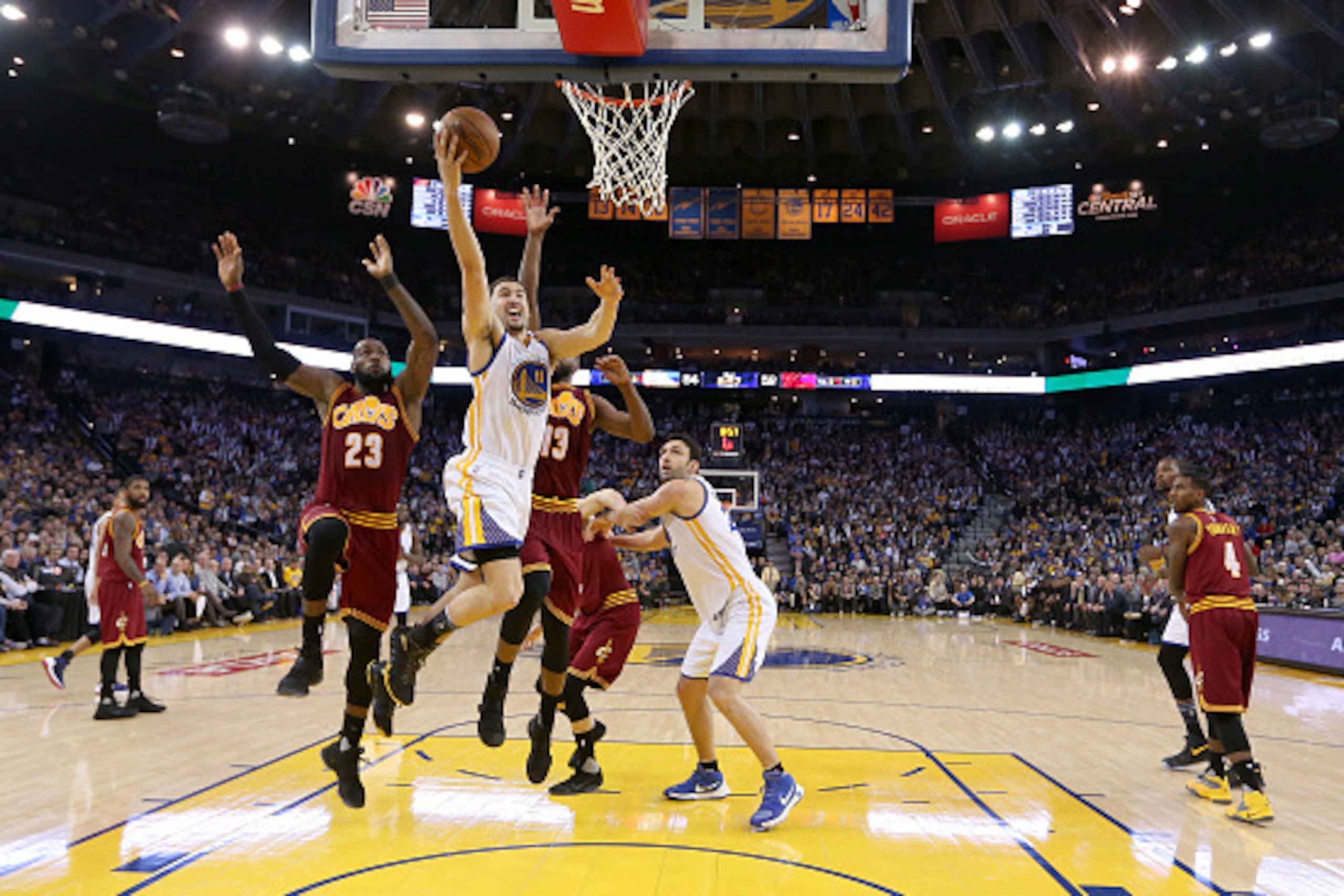 OAKLAND, CA - JANUARY 16:  Klay Thompson #11 of the Golden State Warriors goes up for a shot against LeBron James #23 and Tristan Thompson #13 of the Cleveland Cavaliers at ORACLE Arena on January 16, 2017 in Oakland, California. NOTE TO USER: User expres