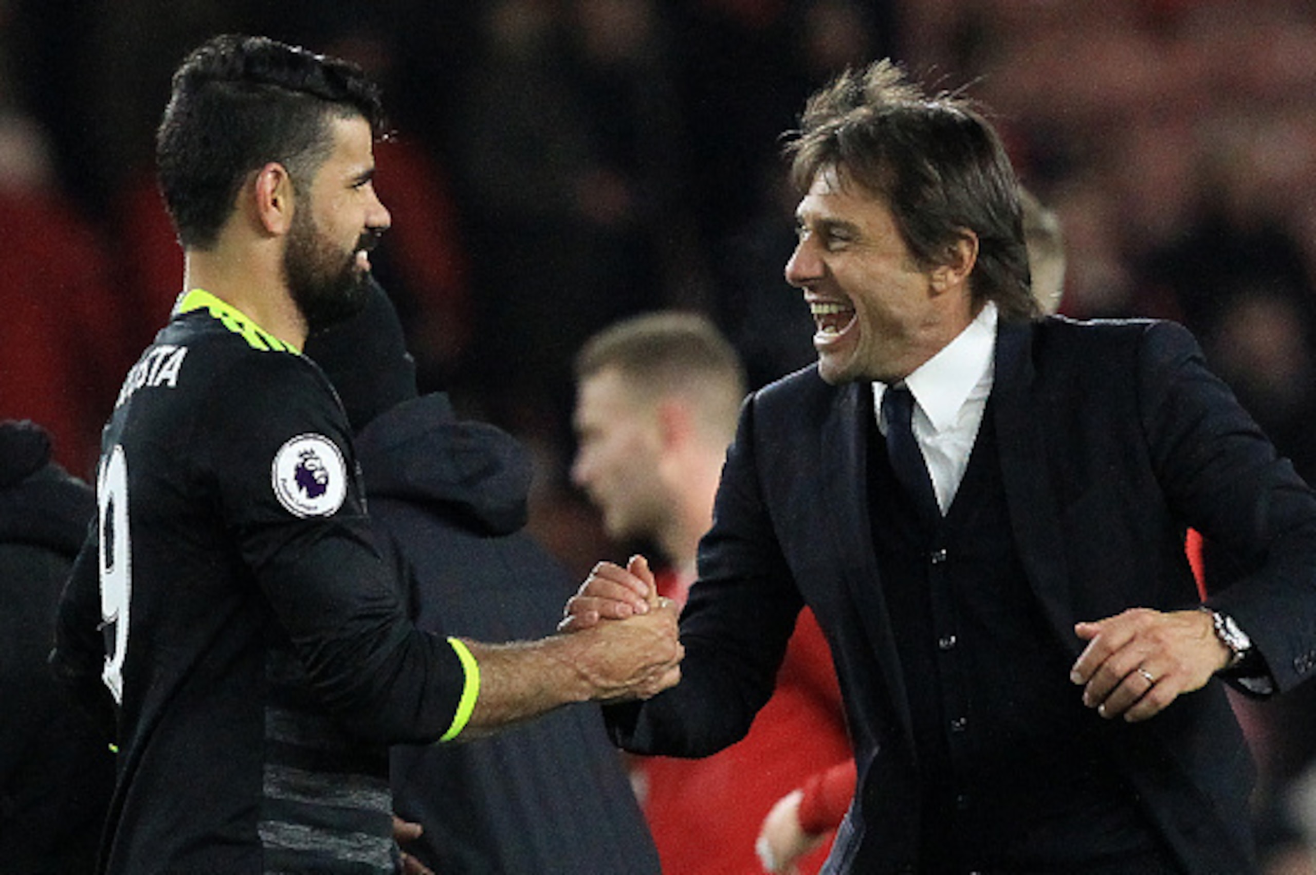Chelsea's Italian head coach Antonio Conte (R) reacts as he congratulates Chelsea's Brazilian-born Spanish striker Diego Costa following the English Premier League football match between Middlesbrough and Cheslea at Riverside Stadium in Middlesbrough, nor