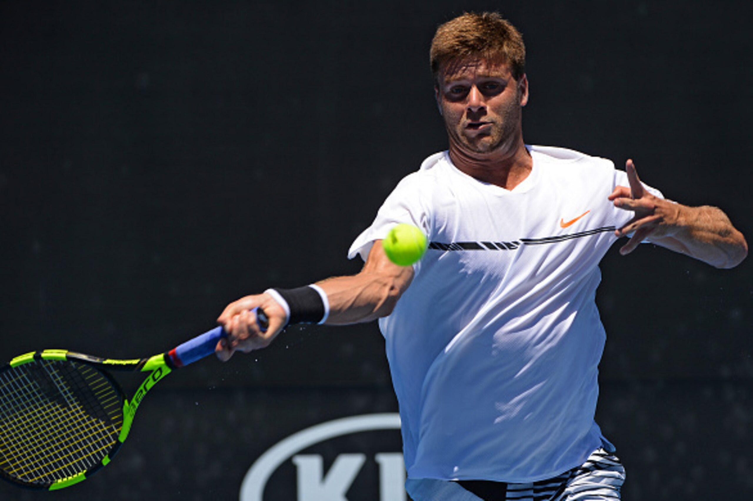 Ryan Harrison of the US hits a return against France's Nicolas Mahut during their men's singles first round match on day one of the Australian Open tennis tournament in Melbourne on January 16, 2017. / AFP / GREG WOOD / --IMAGE RESTRICTED TO EDITORIAL USE Ryan Harrison of the US hits a return against France's Nicolas Mahut during their men's singles first round match on day one of the Australian Open tennis tournament in Melbourne on January 16, 2017. / AFP / GREG WOOD / --IMAGE RESTRICTED TO EDITORIAL USE