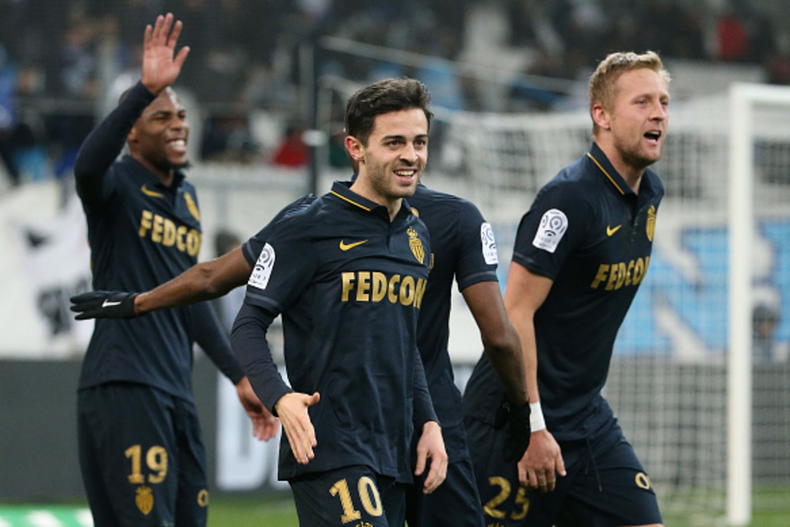 MARSEILLE, FRANCE - JANUARY 15: Bernardo Silva of Monaco celebrates his second goal with Djibril Sidibe, Kamil Glik during the French Ligue 1 match between Olympique de Marseille and AS Monaco at Stade Velodrome on January 15, 2017 in Marseille, France. (