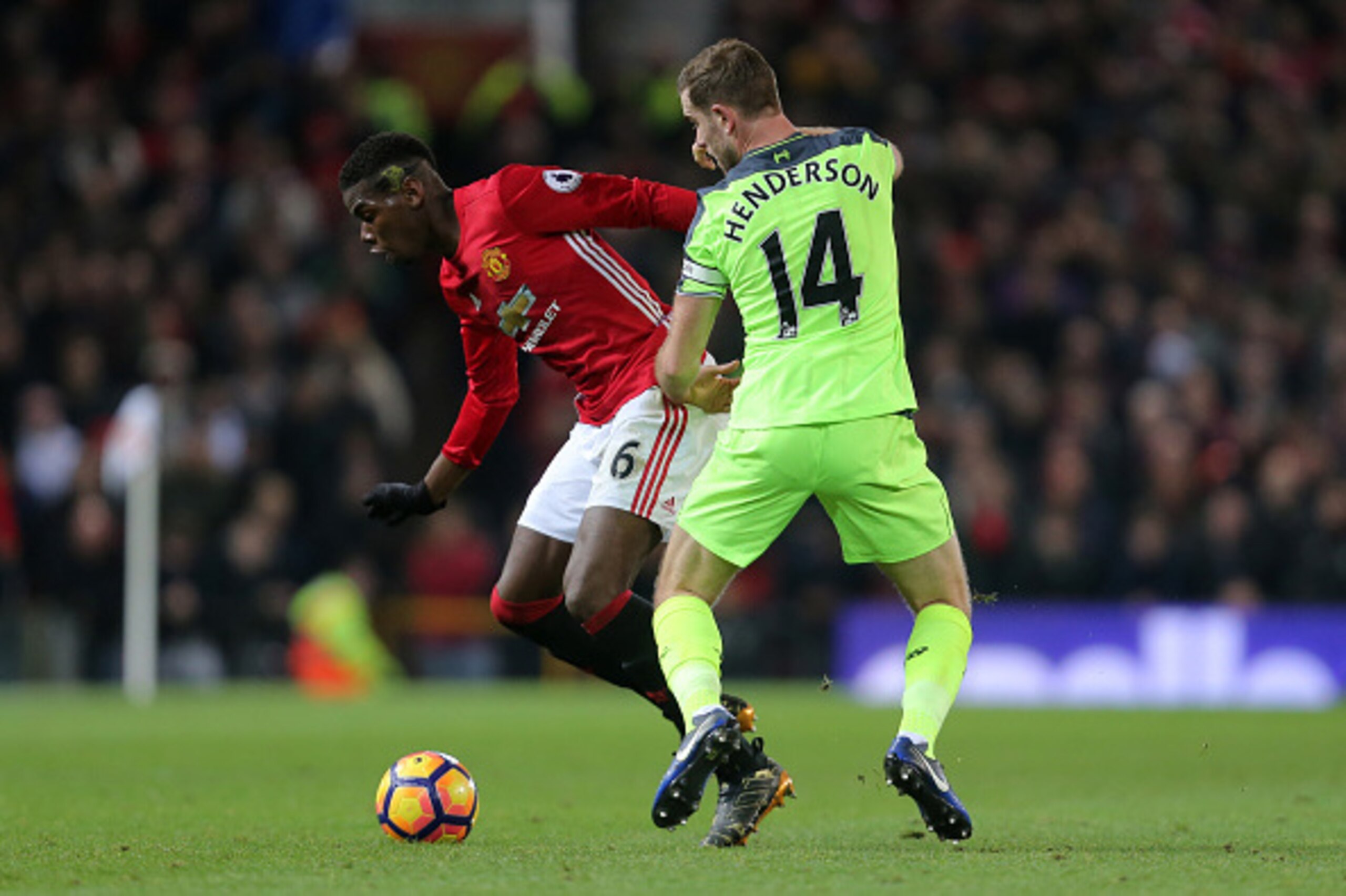 MANCHESTER, ENGLAND - JANUARY 15:  Paul Pogba of Manchester United competes for the ball with Jordan Henderson of Liverpool during the Premier League match between Manchester United and Liverpool at Old Trafford on January 15, 2017 in Manchester, England.