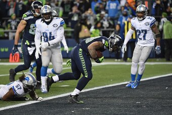 SEATTLE, WA - JANUARY 07:  Thomas Rawls #34 of the Seattle Seahawks scores a 4-yard touchdown during the fourth quarter against the Detroit Lions in the NFC Wild Card game at CenturyLink Field on January 7, 2017 in Seattle, Washington.  (Photo by Steve Dy