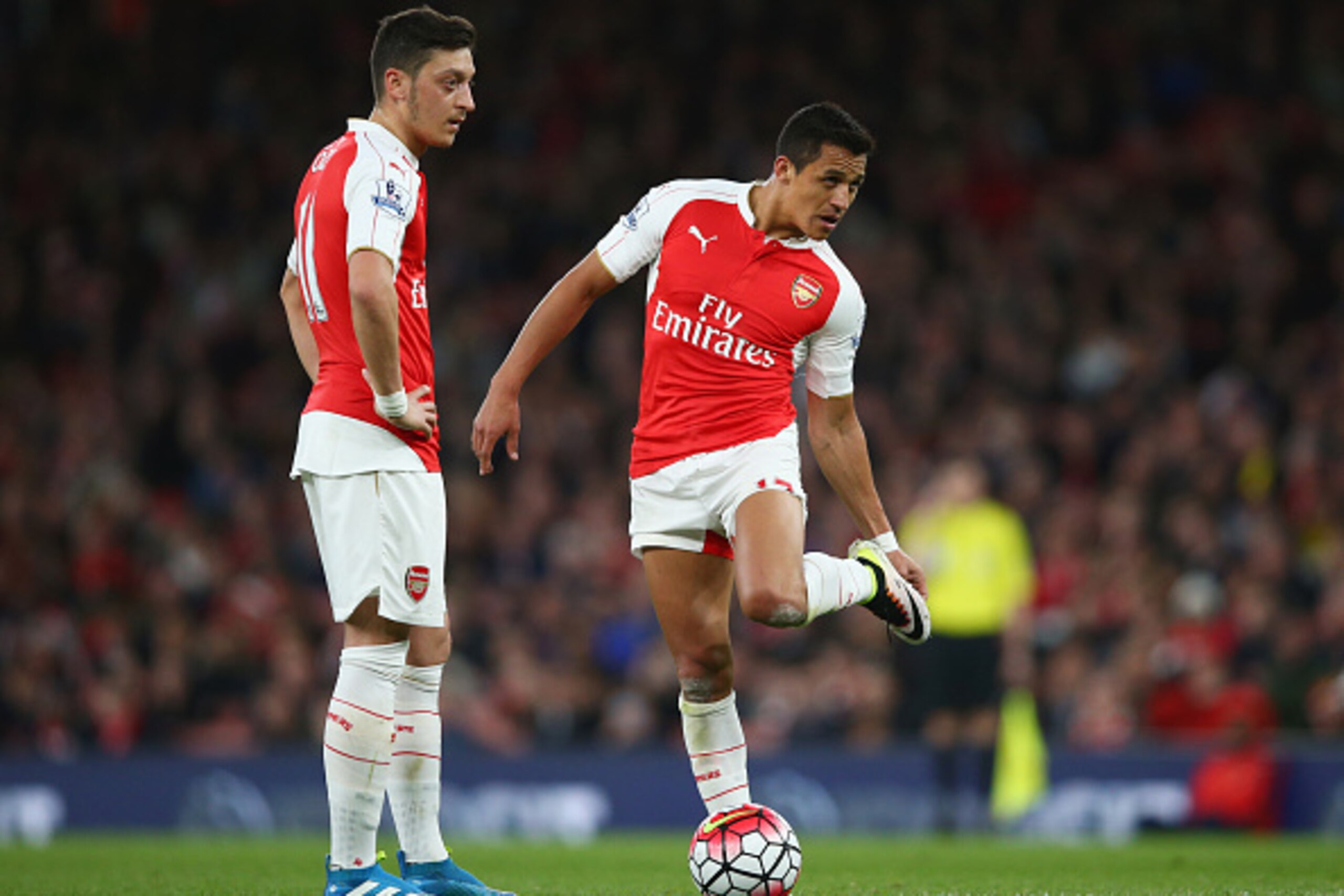 LONDON, ENGLAND - APRIL 21:  Mesut Ozil and Alexis Sanchez of Arsenal prepare to kick off during the Barclays Premier League match between Arsenal and West Bromwich Albion at the Emirates Stadium on April 21, 2016 in London, England.  (Photo by Paul Gilha