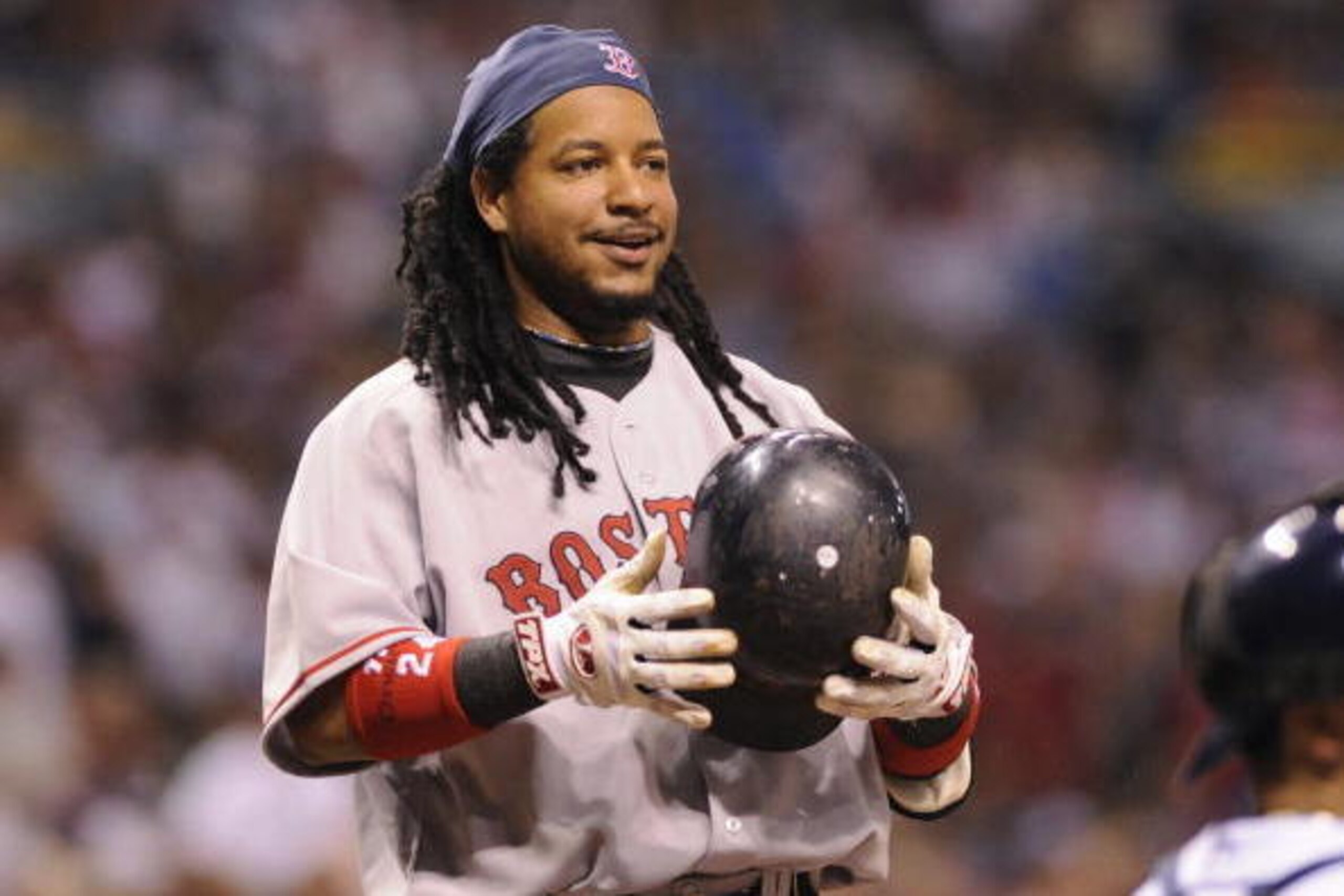 ST PETERSBURG, FL - July 2: Designated hitter Manny Ramirez #24 of the Boston Red Sox smiles after ducking from an inside pitch against the Tampa Bay Rays July 2, 2008 at Tropicana Field in St. Petersburg, Florida. (Photo by Al Messerschmidt/Getty Image ST PETERSBURG, FL - July 2: Designated hitter Manny Ramirez #24 of the Boston Red Sox smiles after ducking from an inside pitch against the Tampa Bay Rays July 2, 2008 at Tropicana Field in St. Petersburg, Florida. (Photo by Al Messerschmidt/Getty Image