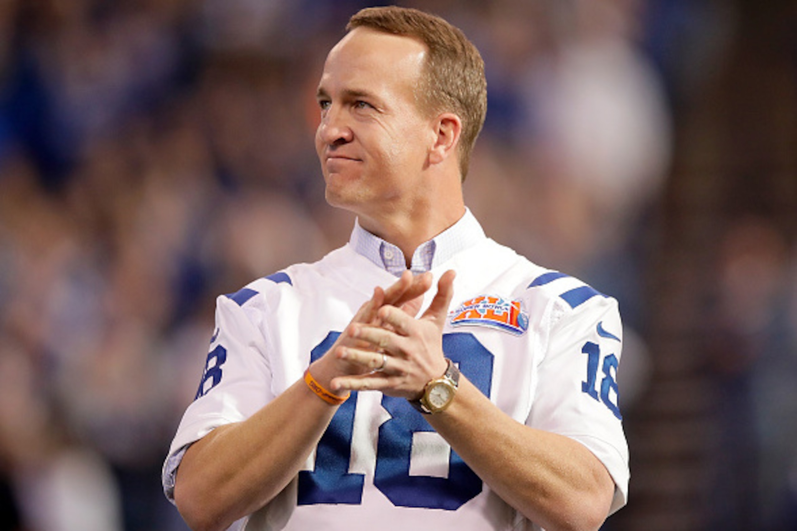 INDIANAPOLIS, IN - NOVEMBER 20:  Peyton Manning, former Indianapolis Colts quarterback, reacts during a ceremony honoring the 10 year anniversary of the Super Bowl winning team during the halftime of the game between the Indianapolis Colts and the Tenness
