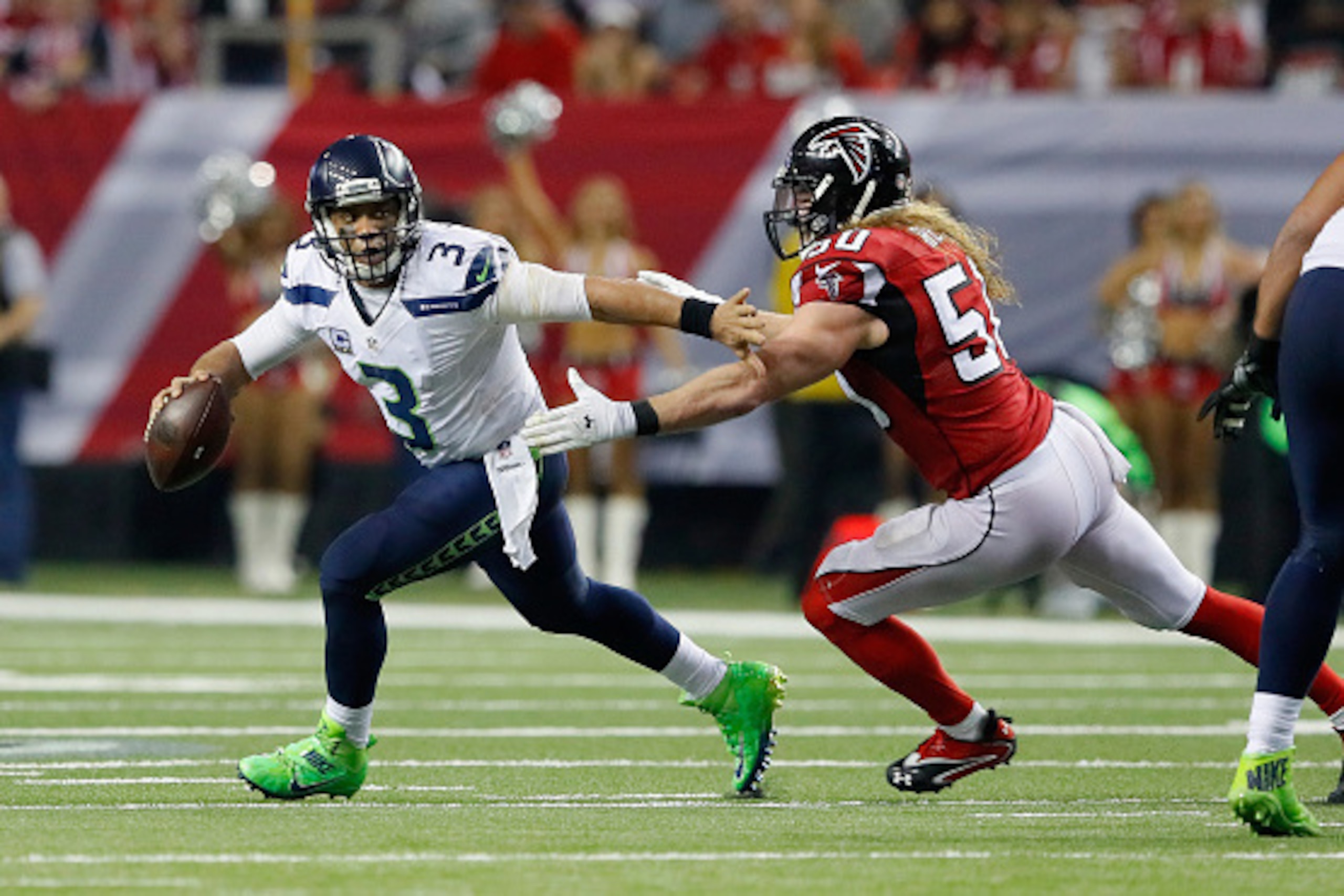 ATLANTA, GA - JANUARY 14:   Brooks Reed #50 of the Atlanta Falcons trys to tackle  Russell Wilson #3 of the Seattle Seahawks at the Georgia Dome on January 14, 2017 in Atlanta, Georgia.  (Photo by Kevin C. Cox/Getty Images)