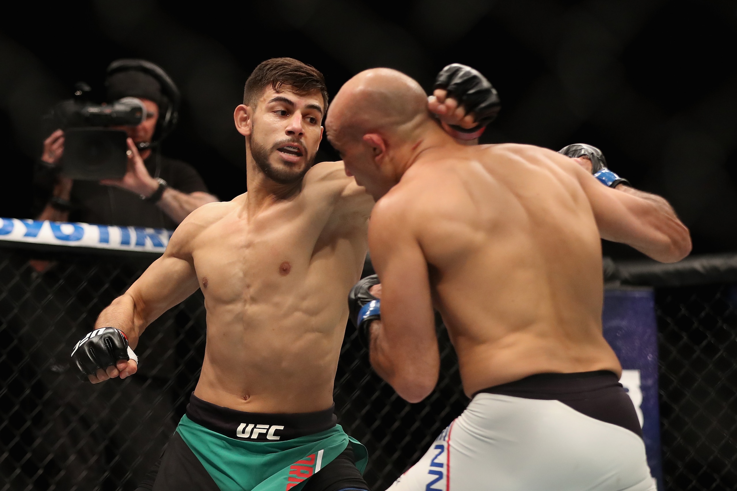 PHOENIX, AZ - JANUARY 15:  Yair Rodriguez (L) throws a left on BJ Penn during the UFC Fight Night event at the at Talking Stick Resort Arena on January 15, 2017 in Phoenix, Arizona.  (Photo by Christian Petersen/Getty Images)