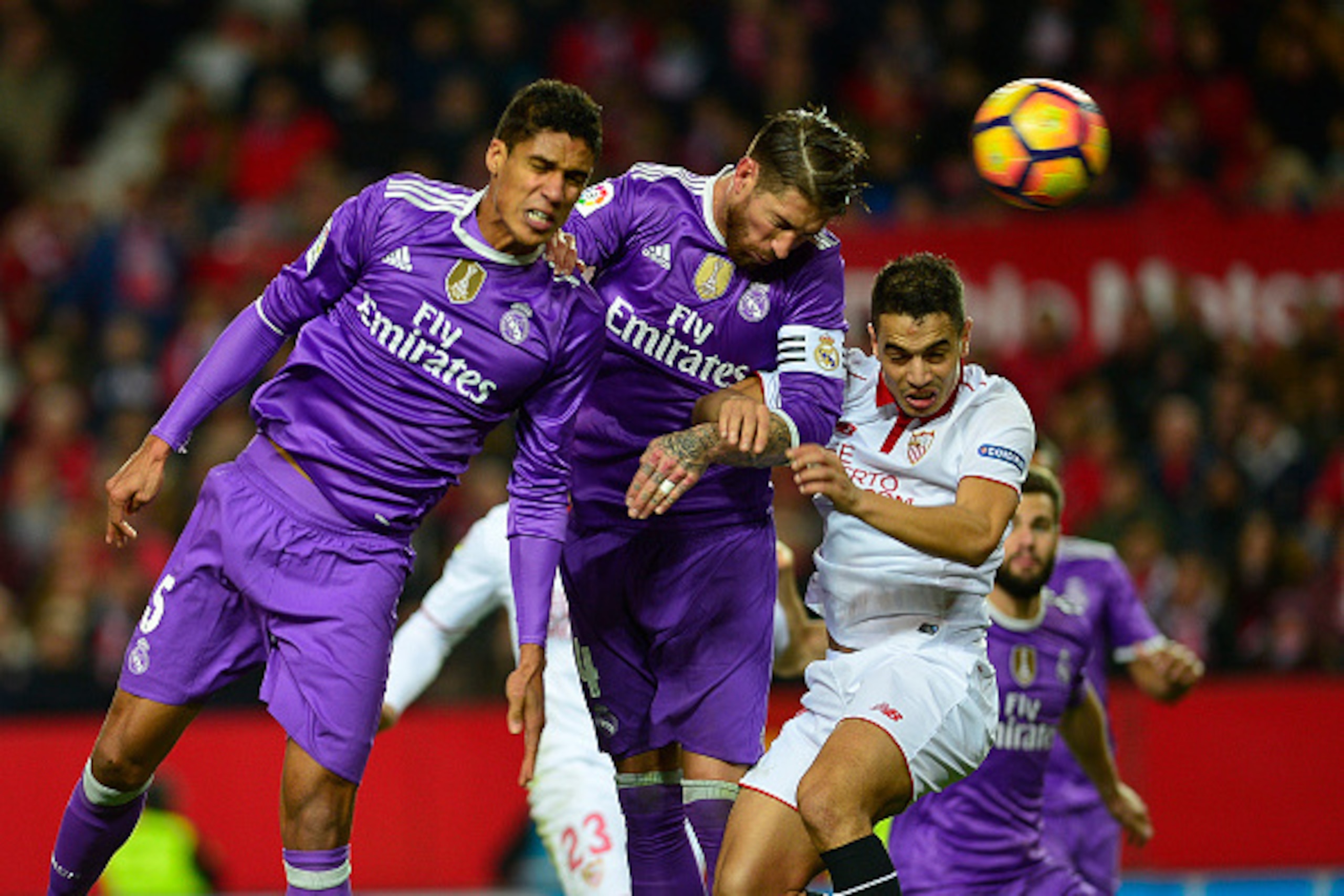 Real Madrid's defender Sergio Ramos (C) scored an own goal during the Spanish league football match Sevilla FC vs Real Madrid CF at the Ramon Sanchez Pizjuan stadium in Sevilla on January 15, 2017.
Sevilla won 2-1. / AFP / CRISTINA QUICLER        (Photo c