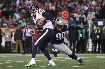 FOXBORO, MA - JANUARY 14: Brock Osweiler #17 of the Houston Texans is tackled by Malcom Brown #90 of the New England Patriots in the second half during the AFC Divisional Playoff Game at Gillette Stadium on January 14, 2017 in Foxboro, Massachusetts.  (Ph