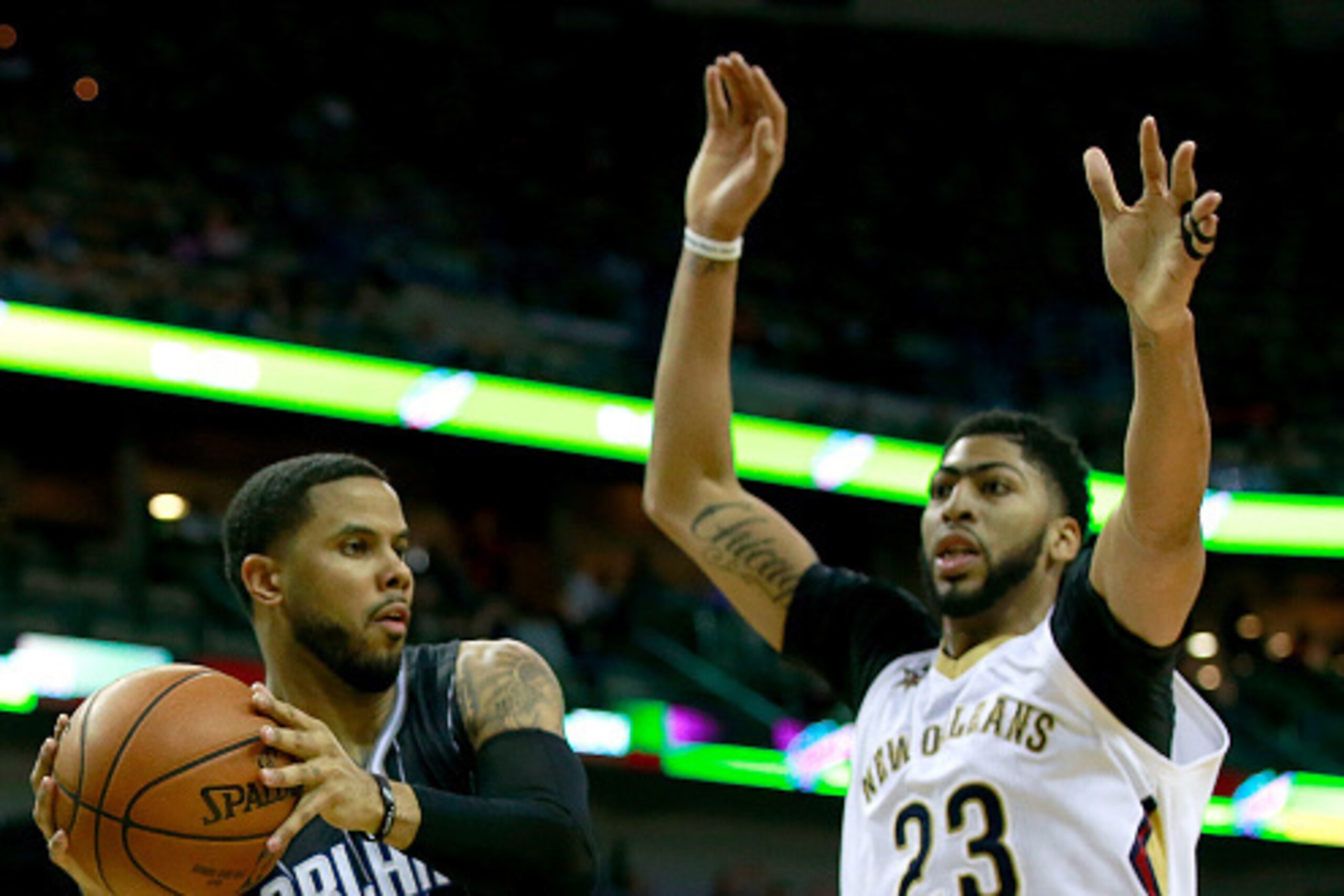 NEW ORLEANS, LA - JANUARY 18:  D.J. Augustin #14 of the Orlando Magic looks to pass the ball around Anthony Davis #23 of the New Orleans Pelicans during the second half of a game at the Smoothie King Center on January 18, 2017 in New Orleans, Louisiana. N