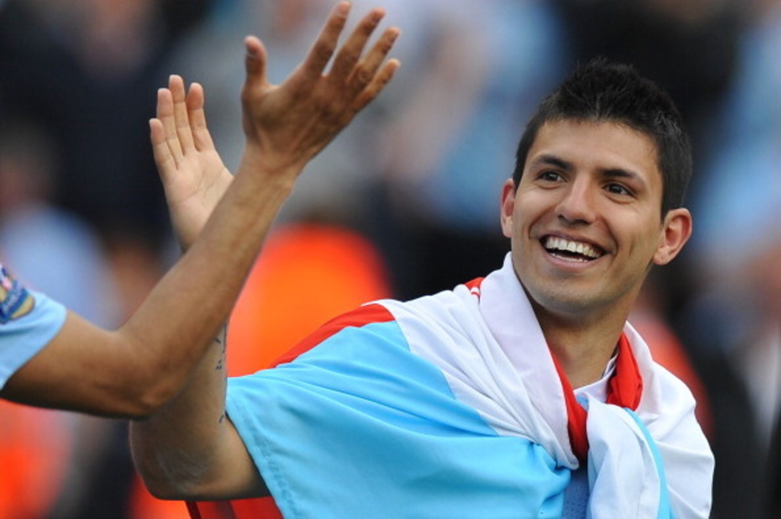 Manchester City's Argentinian striker Sergio Aguero celebrates on the pitch after their 3-2 victory over Queens Park Rangers in the English Premier League football match between Manchester City and Queens Park Rangers at The Etihad stadium in Manchester, 