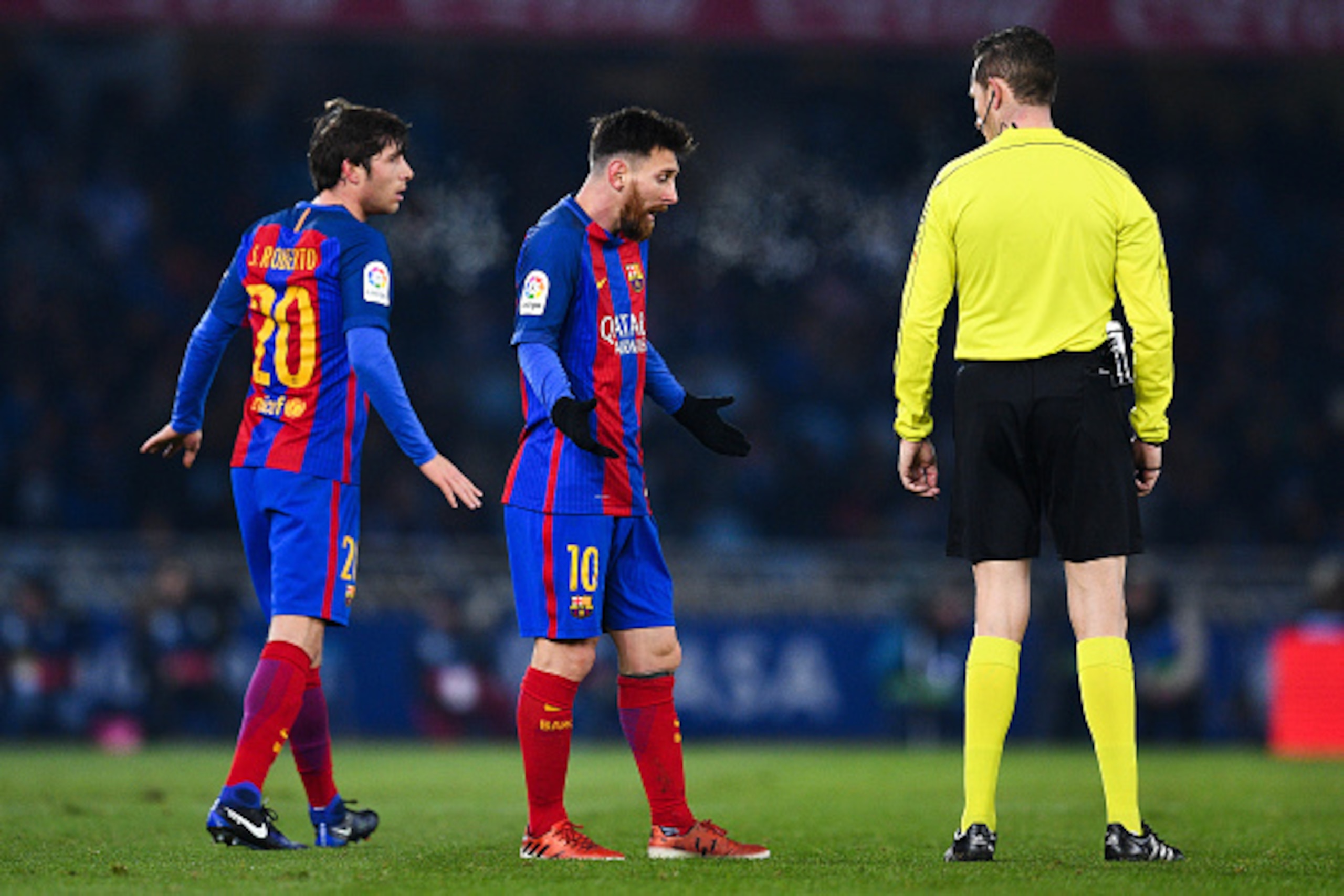 SAN SEBASTIAN, SPAIN - JANUARY 19:  Lionel Messi of FC Barcelona argues with the referee Gonzalez Gonzalez during the Copa del Rey quarter-final first leg match between Real Sociedad and FC Barcelona at Anoeta stadium on January 19, 2017 in San Sebastian,