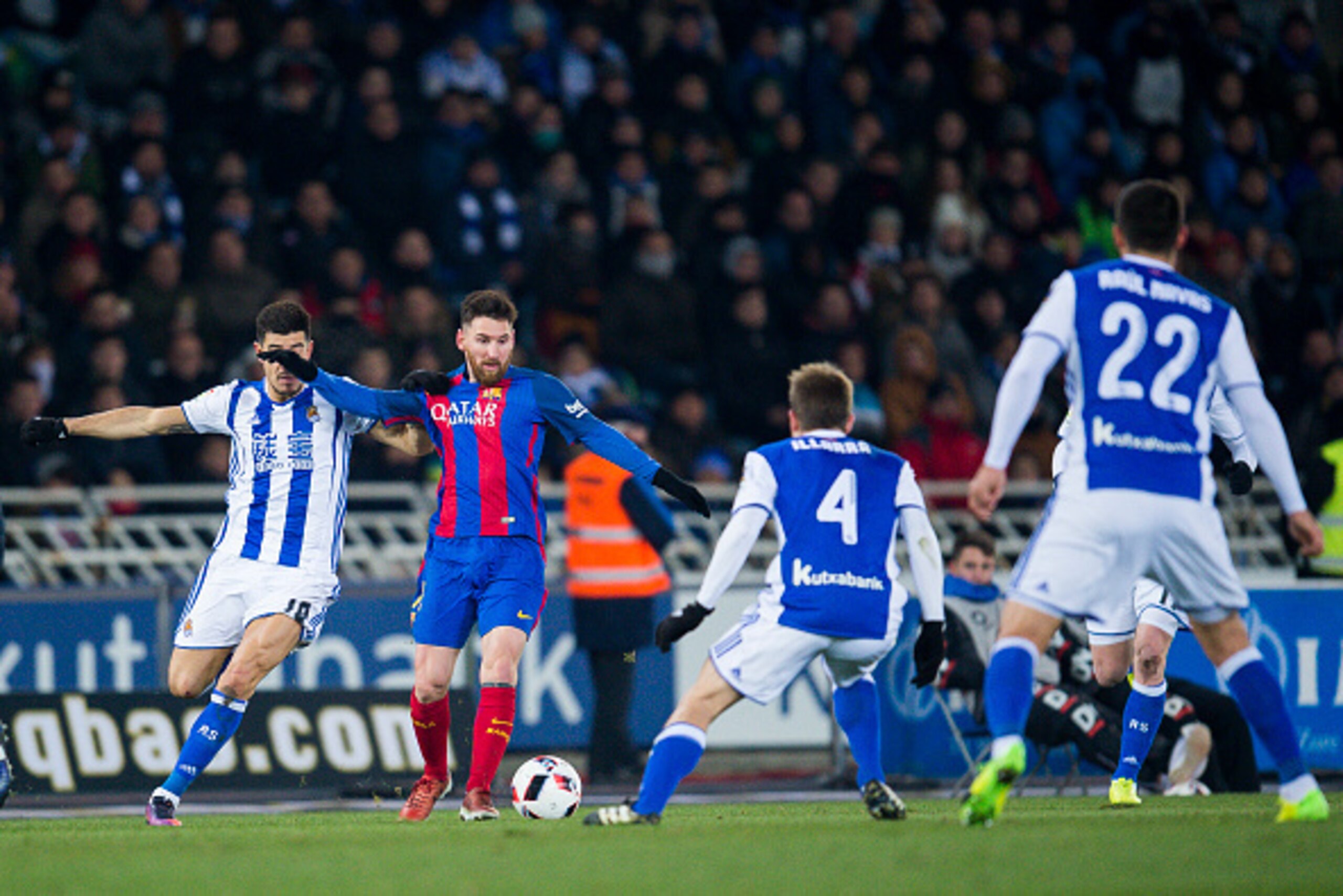 SAN SEBASTIAN, SPAIN - JANUARY 19:  Lionel Messi of FC Barcelona duels for the ball with Yuri Berchiche of Real Sociedad during the Copa del Rey Quarter Final, First Leg match between Real Sociedad de Futbol and FC Barcelona at Estadio Anoeta on January 1