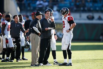 JACKSONVILLE, FL - DECEMBER 20: Matt Ryan #2 of the Atlanta Falcons talks to offensive coordinator Kyle Shanahan and head coach Dan Quinn during the game against the Jacksonville Jaguars at EverBank Field on December 20, 2015 in Jacksonville, Florida. The