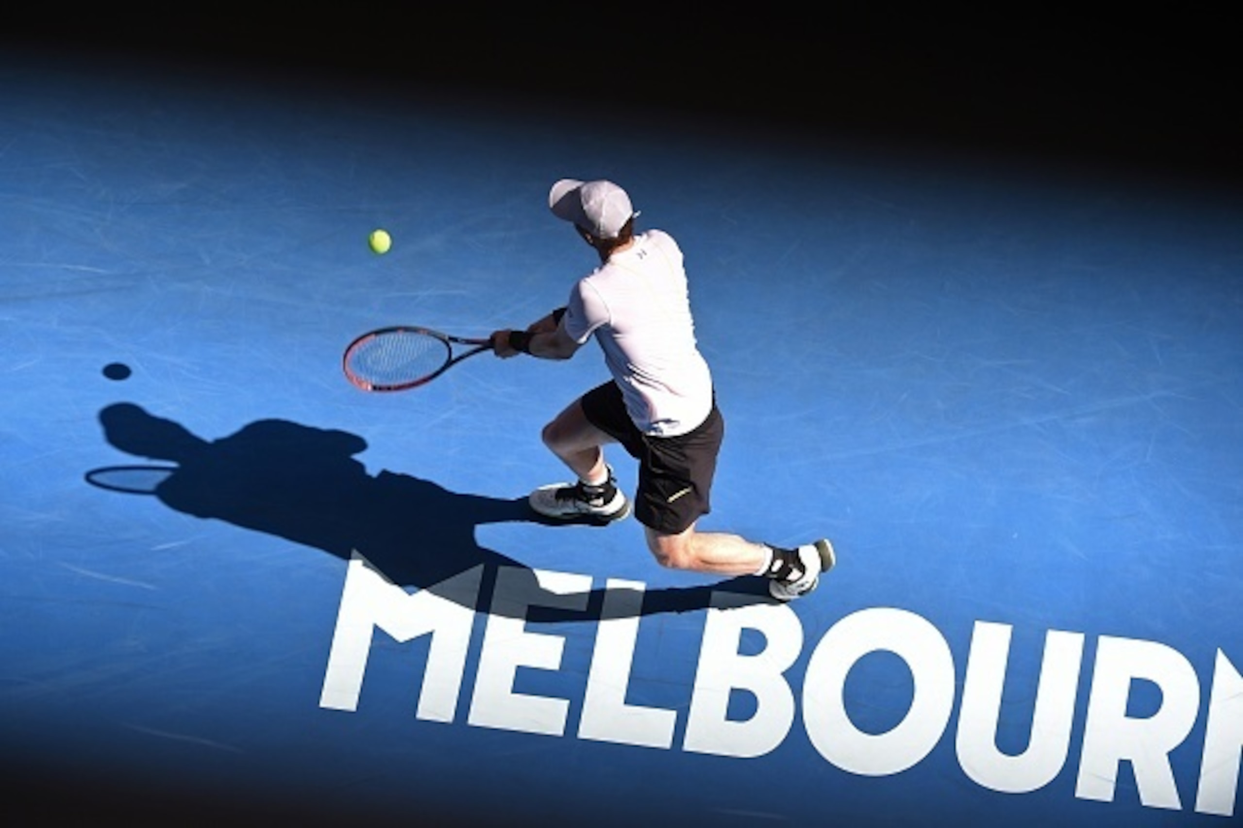Britain's Andy Murray hits a return against Sam Querrey of the US during their men's singles third round match on day five of the Australian Open tennis tournament in Melbourne on January 20, 2017. / AFP / SAEED KHAN / IMAGE RESTRICTED TO EDITORIAL USE - 