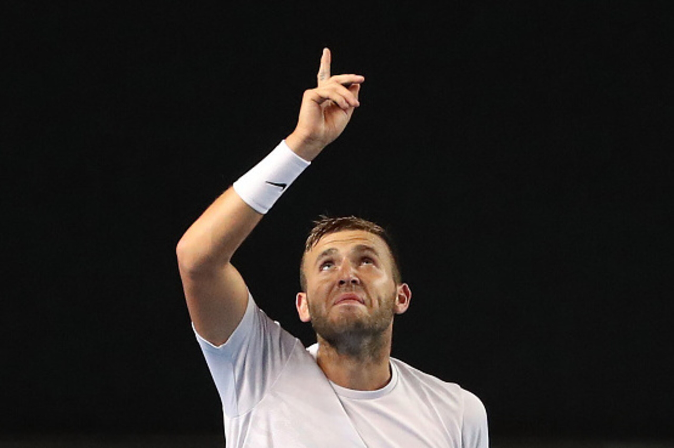 MELBOURNE, AUSTRALIA - JANUARY 20:  Daniel Evans of Great Britain celebrates match point and winning his third round match against Bernard Tomic of Australia on day five of the 2017 Australian Open at Melbourne Park on January 20, 2017 in Melbourne, Austr
