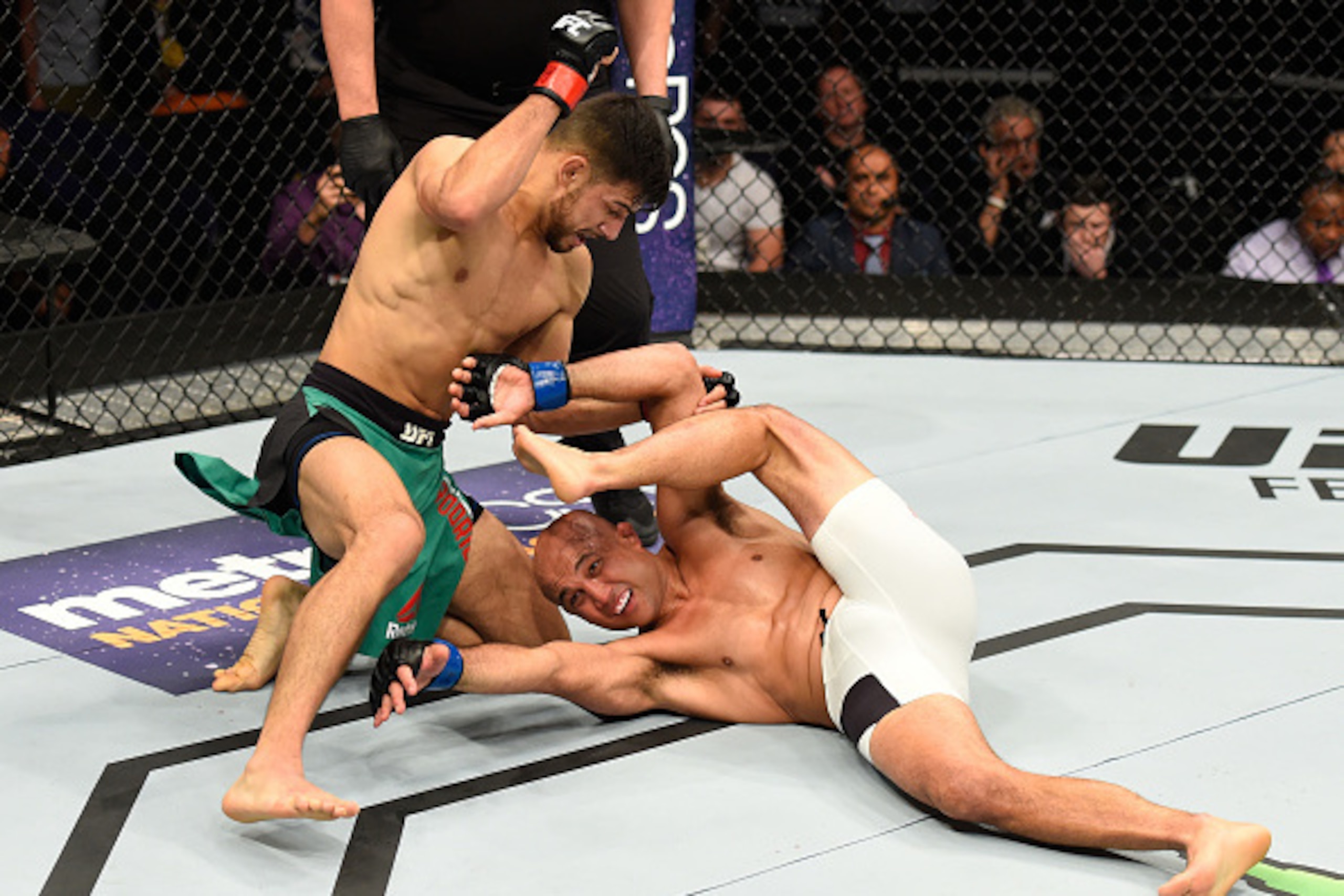 PHOENIX, AZ - JANUARY 15:  (L-R) Yair Rodriguez of Mexico punches BJ Penn in their featherweight bout during the UFC Fight Night event inside Talking Stick Resort Arena on January 15, 2017 in Phoenix, Arizona. (Photo by Jeff Bottari/Zuffa LLC/Zuffa LLC vi