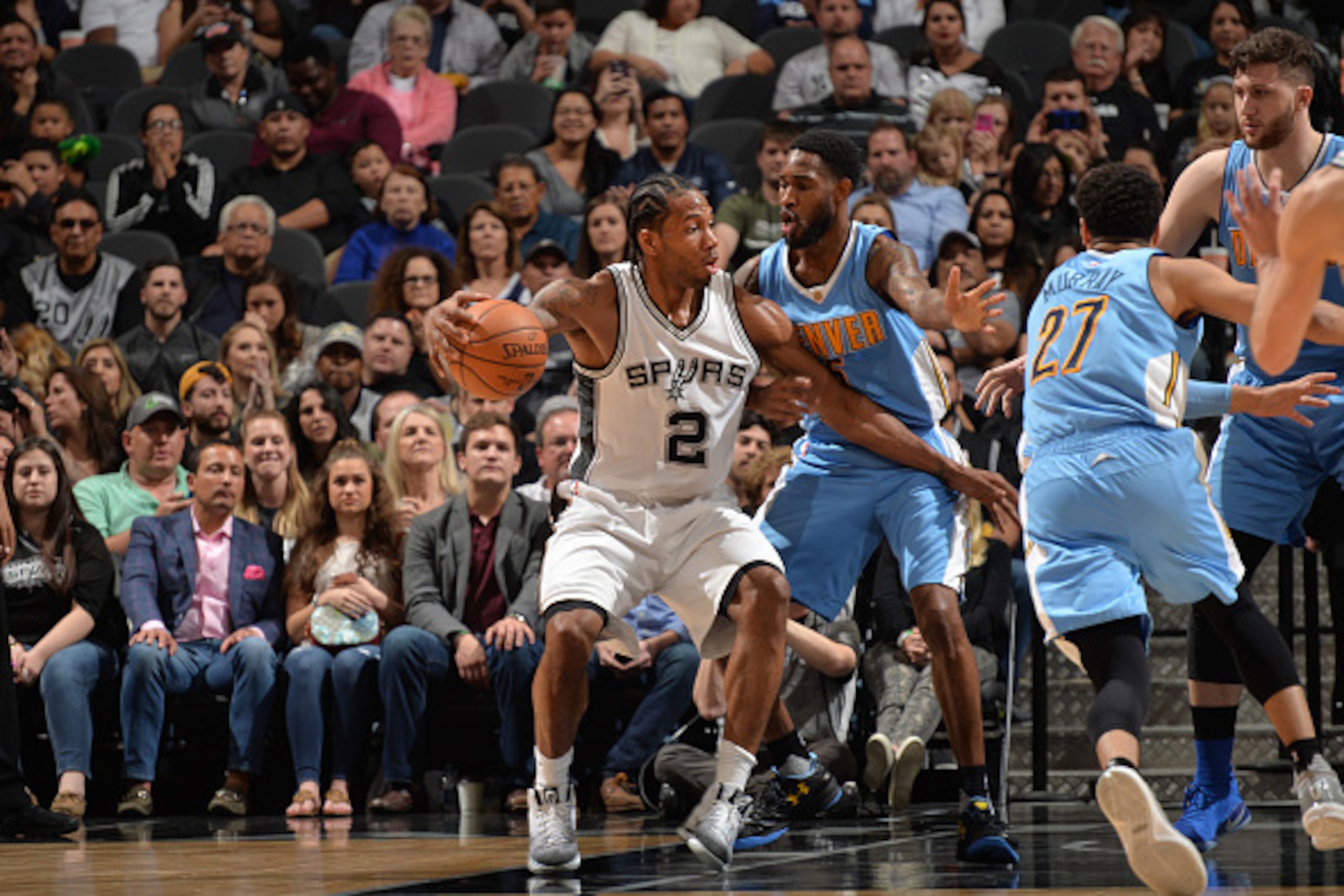 SAN ANTONIO, TX - JANUARY 19:  Kawhi Leonard #2 of the San Antonio Spurs handles the ball during a game against the Denver Nuggets on January 19, 2017 at the AT&T Center in San Antonio, Texas. NOTE TO USER: User expressly acknowledges and agrees that, by 