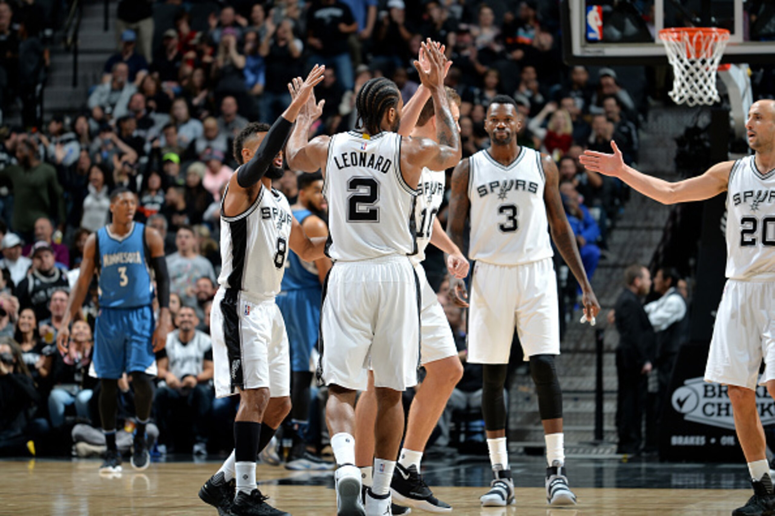 SAN ANTONIO, TX - JANUARY 17: Kawhi Leonard #2 of the San Antonio Spurs high fives his teammates during the game against the Minnesota Timberwolves on January 17, 2017 at the AT&T Center in San Antonio, Texas. NOTE TO USER: User expressly acknowledges and