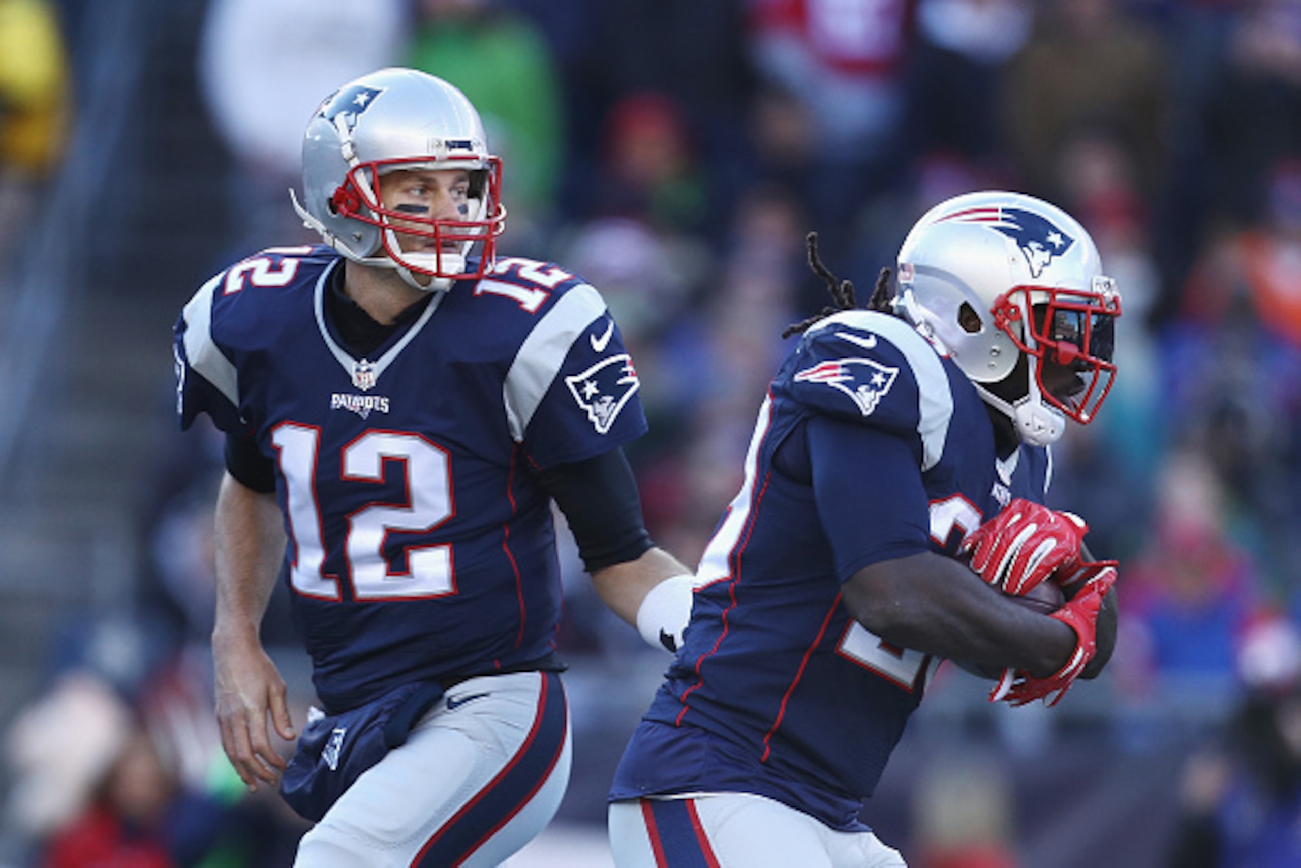 FOXBORO, MA - DECEMBER 04:  Tom Brady #12 of the New England Patriots hands the ball off to LeGarrette Blount #29 during the game against the Los Angeles Rams at Gillette Stadium on December 4, 2016 in Foxboro, Massachusetts.  (Photo by Maddie Meyer/Getty