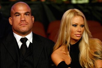 ANAHEIM, CA - NOVEMBER 12:  Fighter Jacob Christopher 'Tito' Ortiz sits with Jenna Jameson during the bout between Alex Caceres and Cole Escovedo during the UFC on FOX event at the Honda Center on November 12, 2011 in Anaheim, California. (Photo by Donald