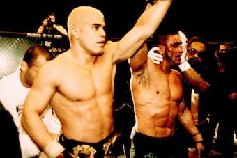 LAS VEGAS, NV - NOVEMBER 22:  Ken Shamrock (R) raises Tito Ortiz's hand in victory after Ortiz defeated Shamrock by unanimous decision at UFC 40 at the MGM Grand Garden Arena on November 22, 2002 in Las Vegas, Nevada.  (Photo by Josh Hedges/Zuffa LLC/Zuff