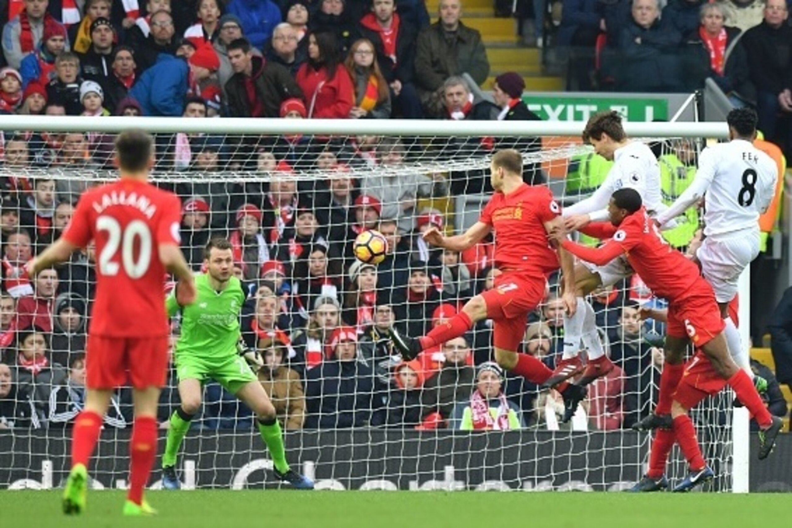 Swansea City's Spanish striker Fernando Llorente (3R) rises high to head the ball and score their second goal during the English Premier League football match between Liverpool and Swansea City at Anfield in Liverpool, north west England on January 21, 20