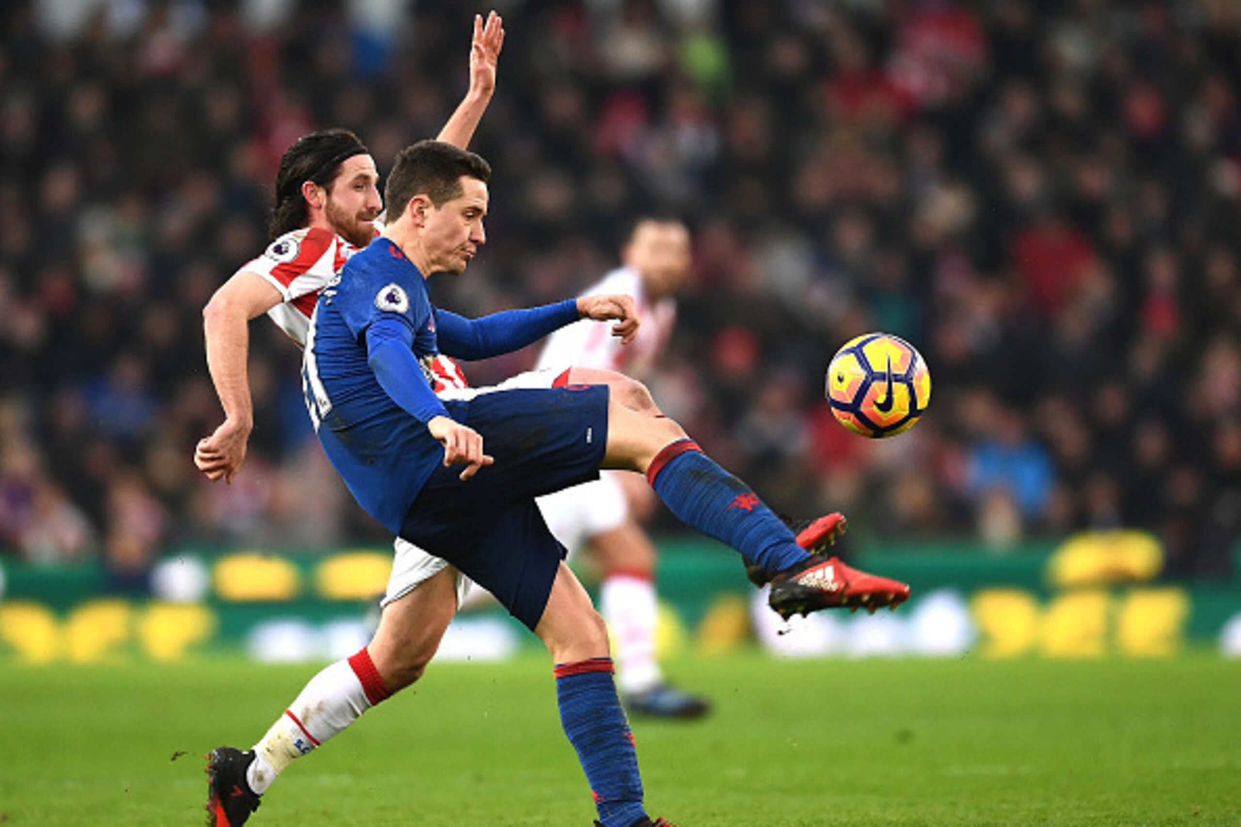 STOKE ON TRENT, ENGLAND - JANUARY 21: Ander Herrera of Manchester United clears the ball from Joe Allen of Stoke City during the Premier League match between Stoke City and Manchester United at Bet365 Stadium on January 21, 2017 in Stoke on Trent, Englan STOKE ON TRENT, ENGLAND - JANUARY 21: Ander Herrera of Manchester United clears the ball from Joe Allen of Stoke City during the Premier League match between Stoke City and Manchester United at Bet365 Stadium on January 21, 2017 in Stoke on Trent, Englan
