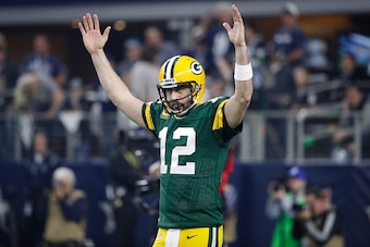 ARLINGTON, TX - JANUARY 15: Aaron Rodgers #12 of the Green Bay Packers reacts after a touchdown during the NFC Divisional Playoff game against the Dallas Cowboys at AT&T Stadium on January 15, 2017 in Arlington, Texas. The Packers defeated the Cowboys 34-