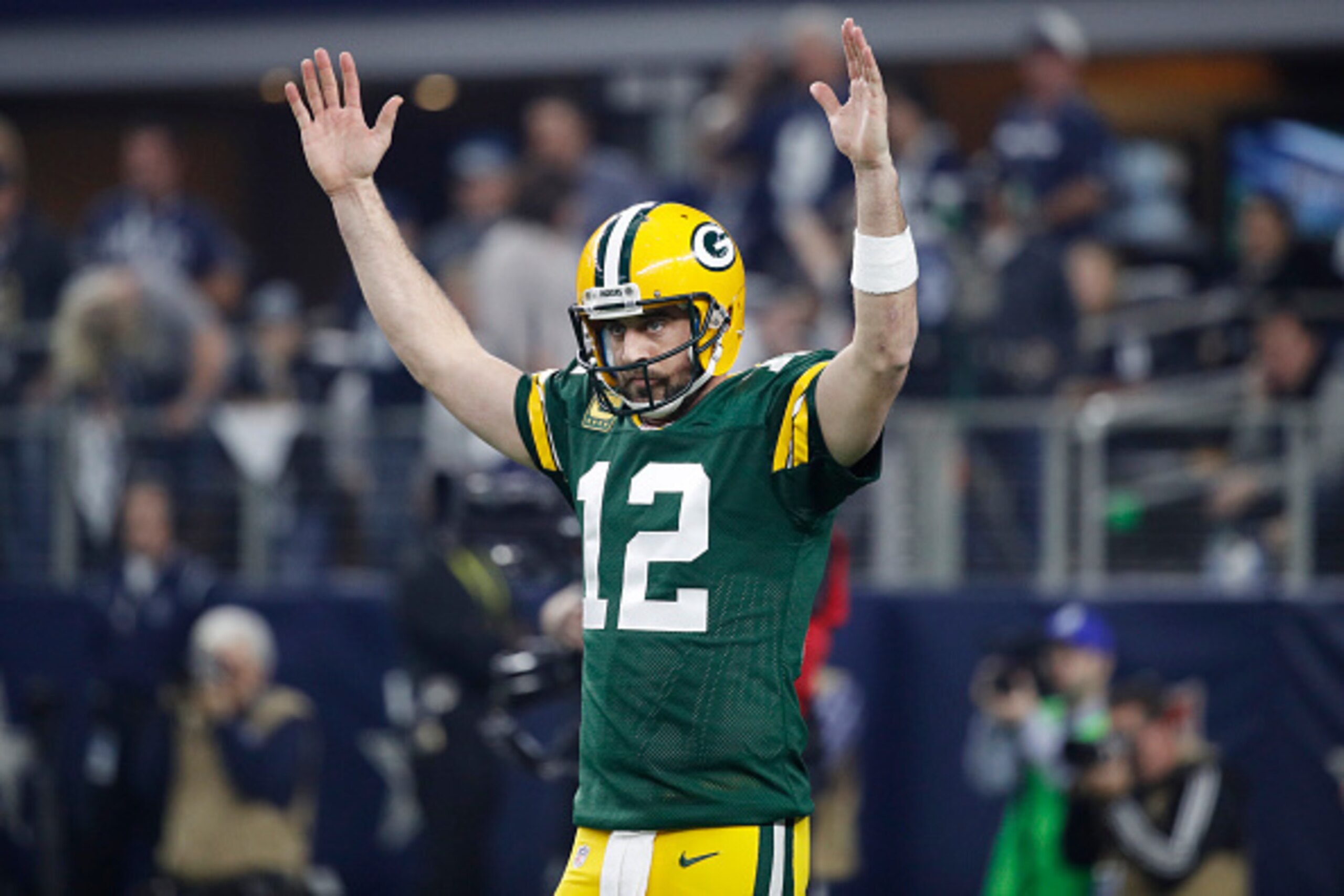 ARLINGTON, TX - JANUARY 15: Aaron Rodgers #12 of the Green Bay Packers reacts after a touchdown during the NFC Divisional Playoff game against the Dallas Cowboys at AT&T Stadium on January 15, 2017 in Arlington, Texas. The Packers defeated the Cowboys 34- ARLINGTON, TX - JANUARY 15: Aaron Rodgers #12 of the Green Bay Packers reacts after a touchdown during the NFC Divisional Playoff game against the Dallas Cowboys at AT&T Stadium on January 15, 2017 in Arlington, Texas. The Packers defeated the Cowboys 34-