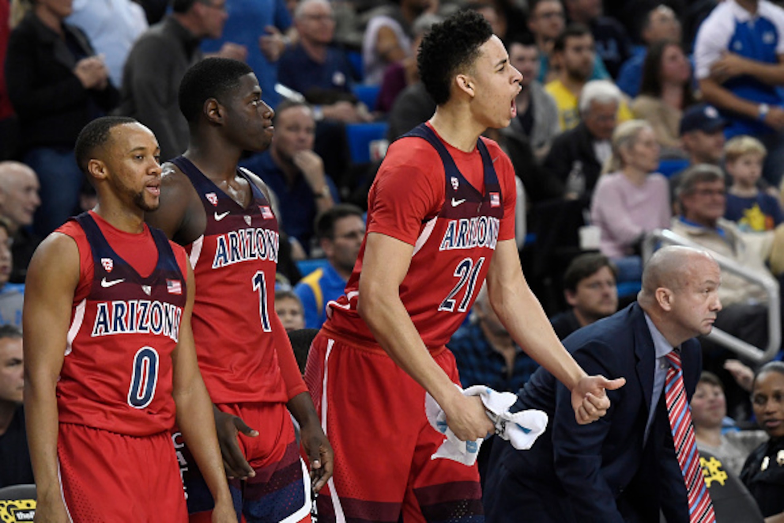 LOS ANGELES, CA - JANUARY 21: Chance Comanche #21 of the Arizona Wildcats celebrates with Parker Jackson-Cartwright #0 and Rawle Alkins #1 during the second half of the game at Pauley Pavilion on January 21, 2017 in Los Angeles, California. (Photo by Kevo