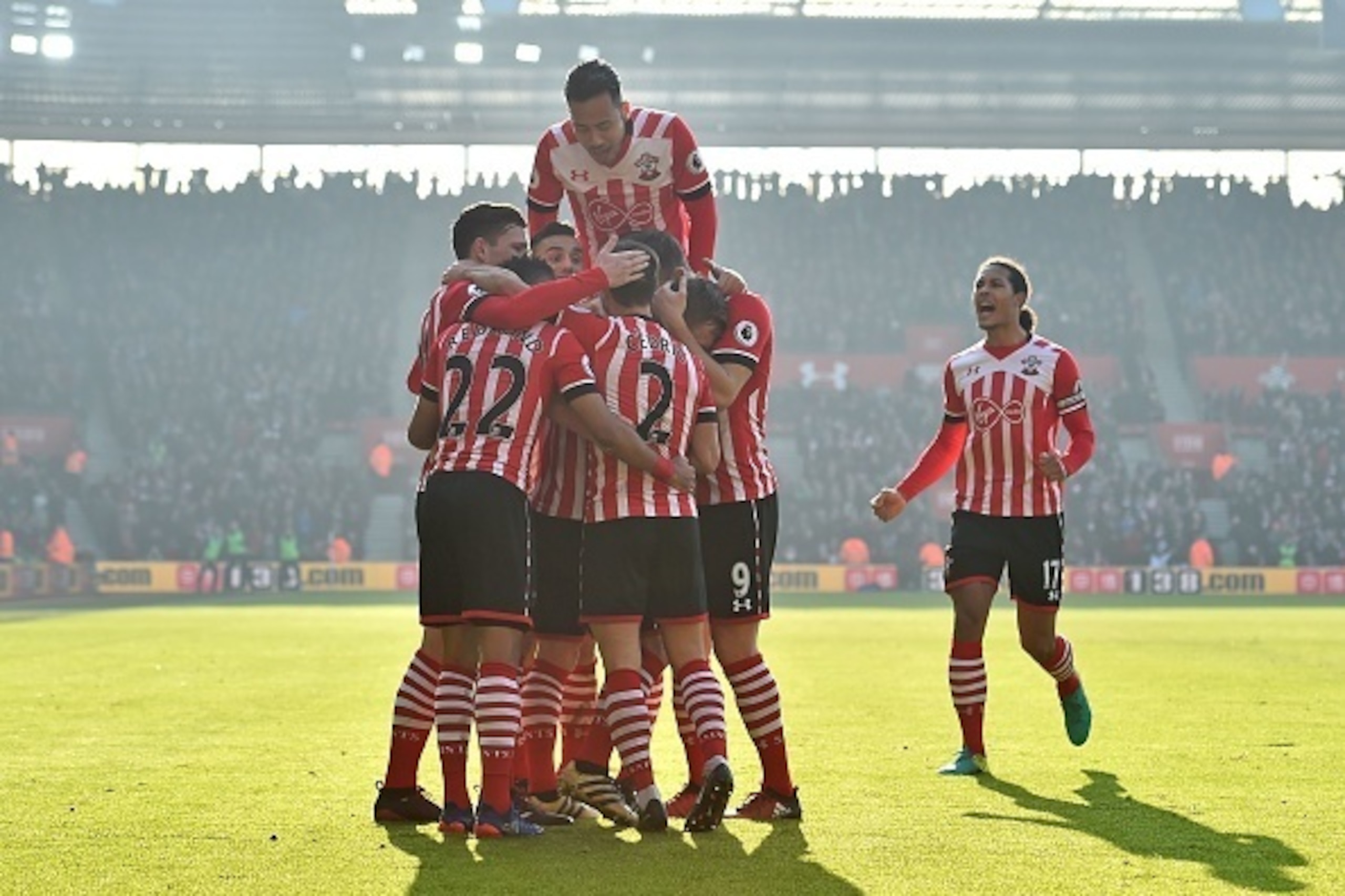 Southampton's English midfielder James Ward-Prowse celebrates with teammates after scoring the opening goal of the English Premier League football match between Southampton and Leicester City at St Mary's Stadium in Southampton, southern England on Januar
