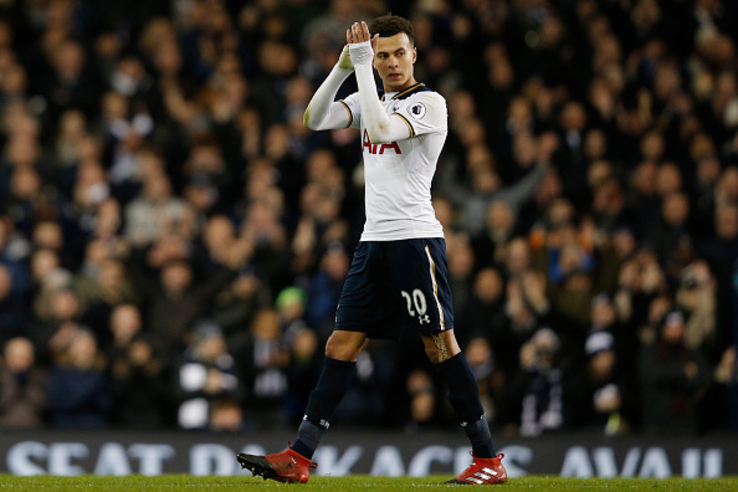 Tottenham Hotspur's English midfielder Dele Alli, scorer of two Tottenham goals applauds as he leaves the pitch, substituted during the English Premier League football match between Tottenham Hotspur and Chelsea at White Hart Lane in London, on January 4,